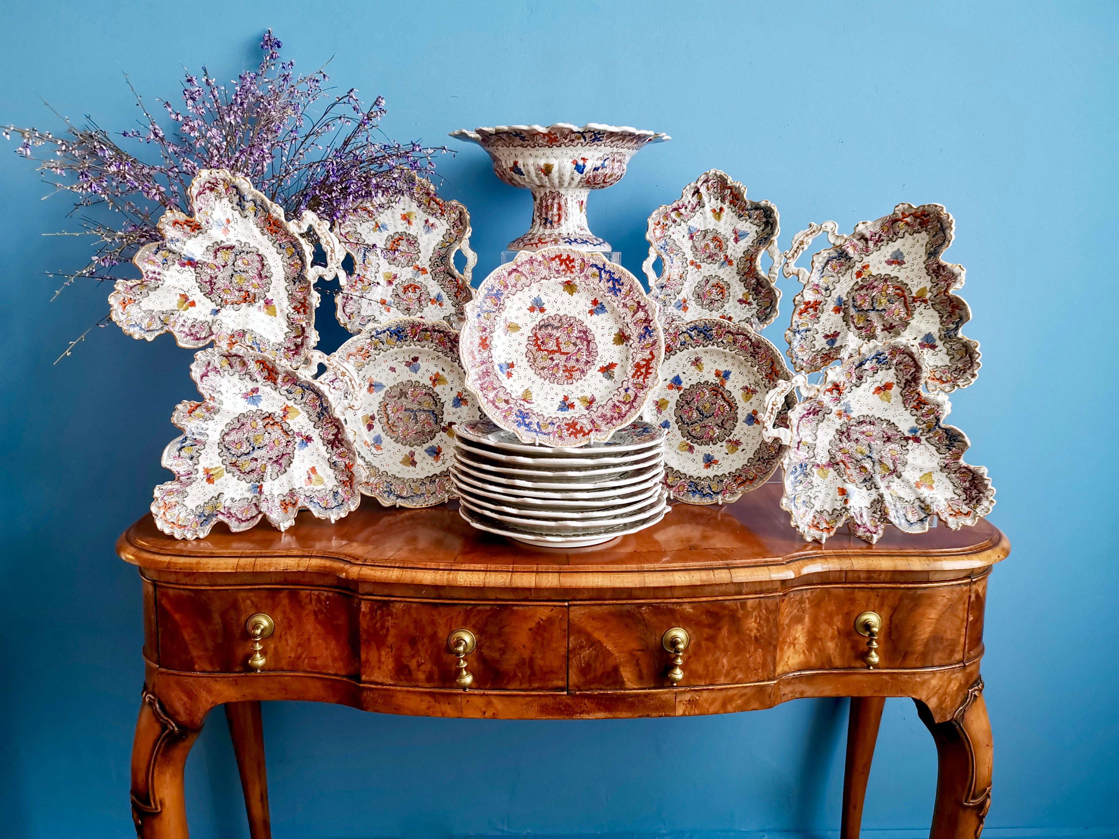 This is a wonderful dessert service made by Miles Mason between 1835 and 1840. It consists of a high footed comport, two rectangular leaf-shaped dishes, four triangular leaf-shaped dishes, and twelve plates.

Miles Mason started making porcelain