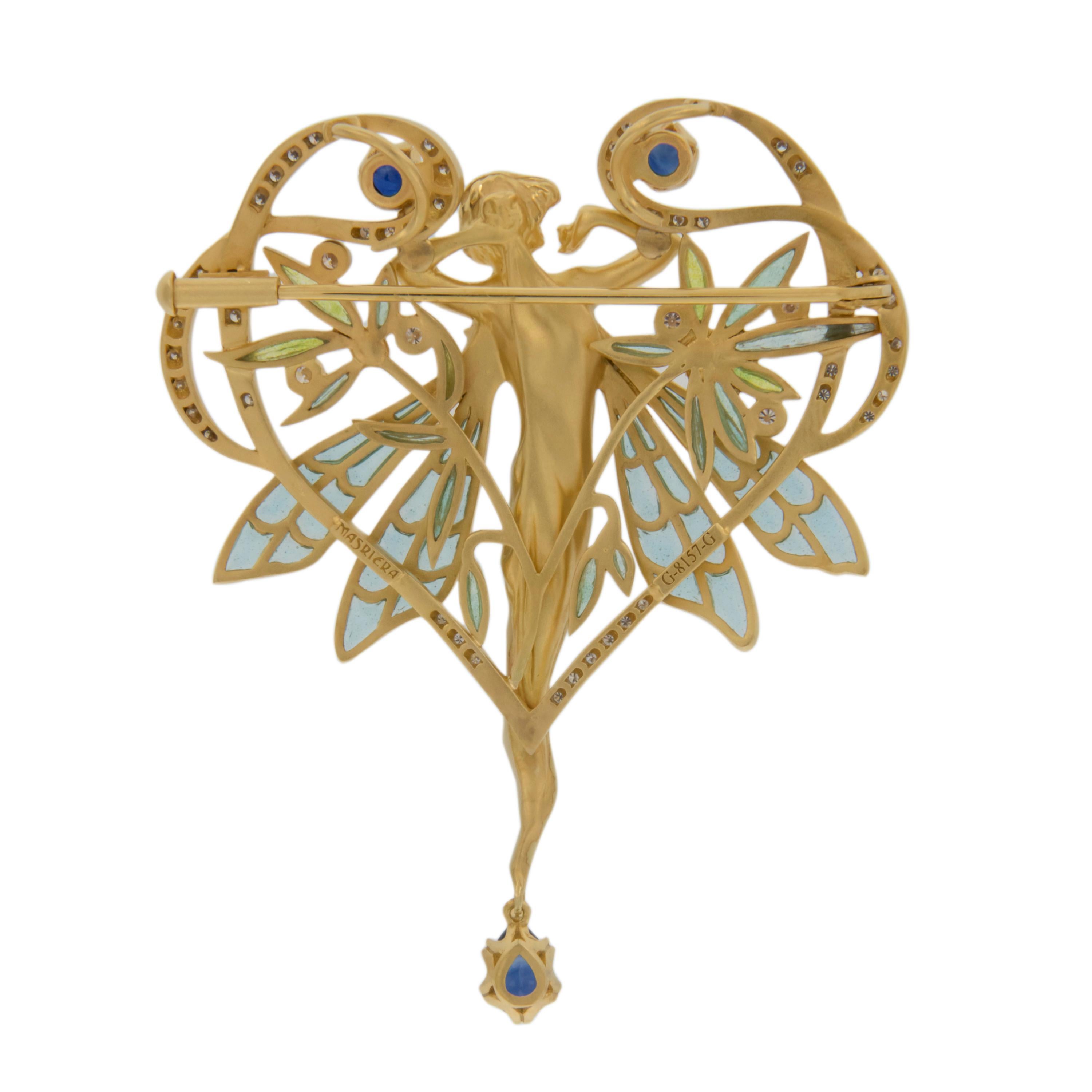 Masriera is a company world-renowned for their amazing enamel work & Art Nouveau jewelry. This 18kt yellow gold pendant brooch with “plique-à-jour” and “basse taille” fired enamel showcases a nymph with delicate wings set off by 0.93 Cttw blue
