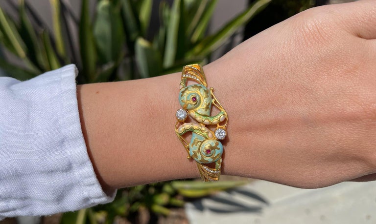 Brand: MASRIERA
Style: Art Nouveau
Gemstones: Rubies, Diamonds, Enamel
Metal: 18K Gold
Bracelet Size: 6.5 Inches