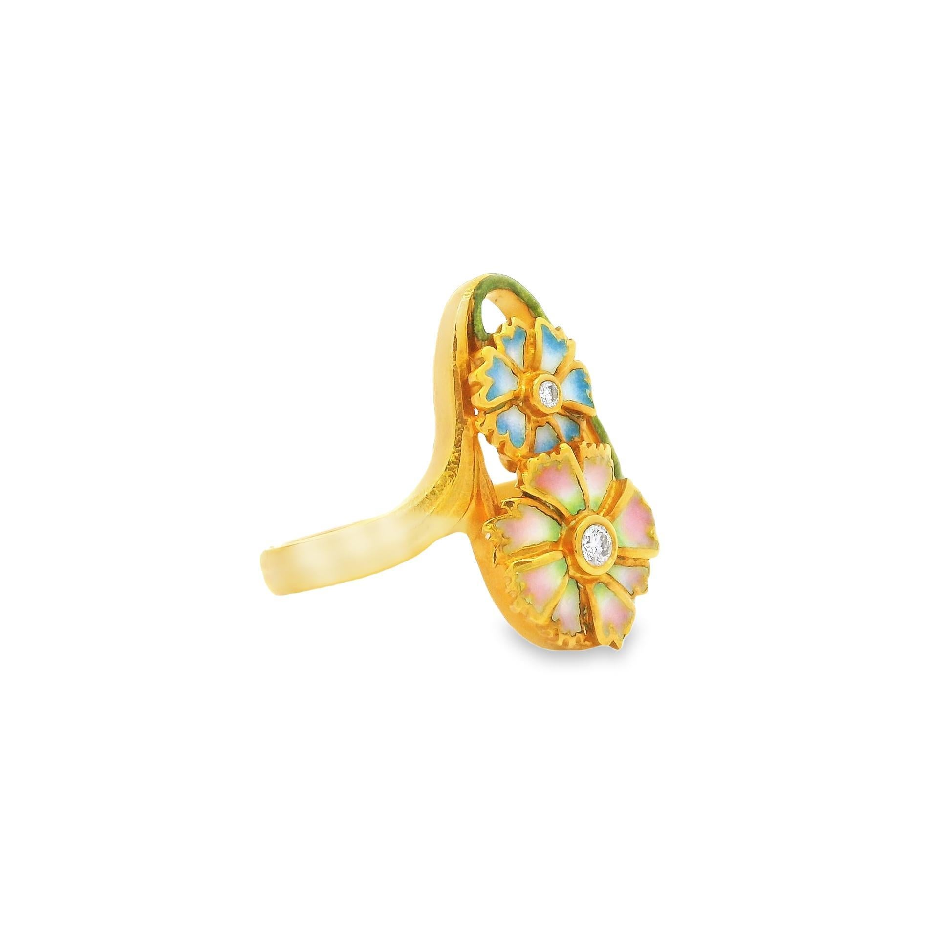 This Art Nouveau style Pliqué à jour enamel diamond ring is an original by Spanish artist and designer Masriera. The organic flowers are magnificent with enamel set without a backing like a stained-glass window which is known as Pliqué à jour. The