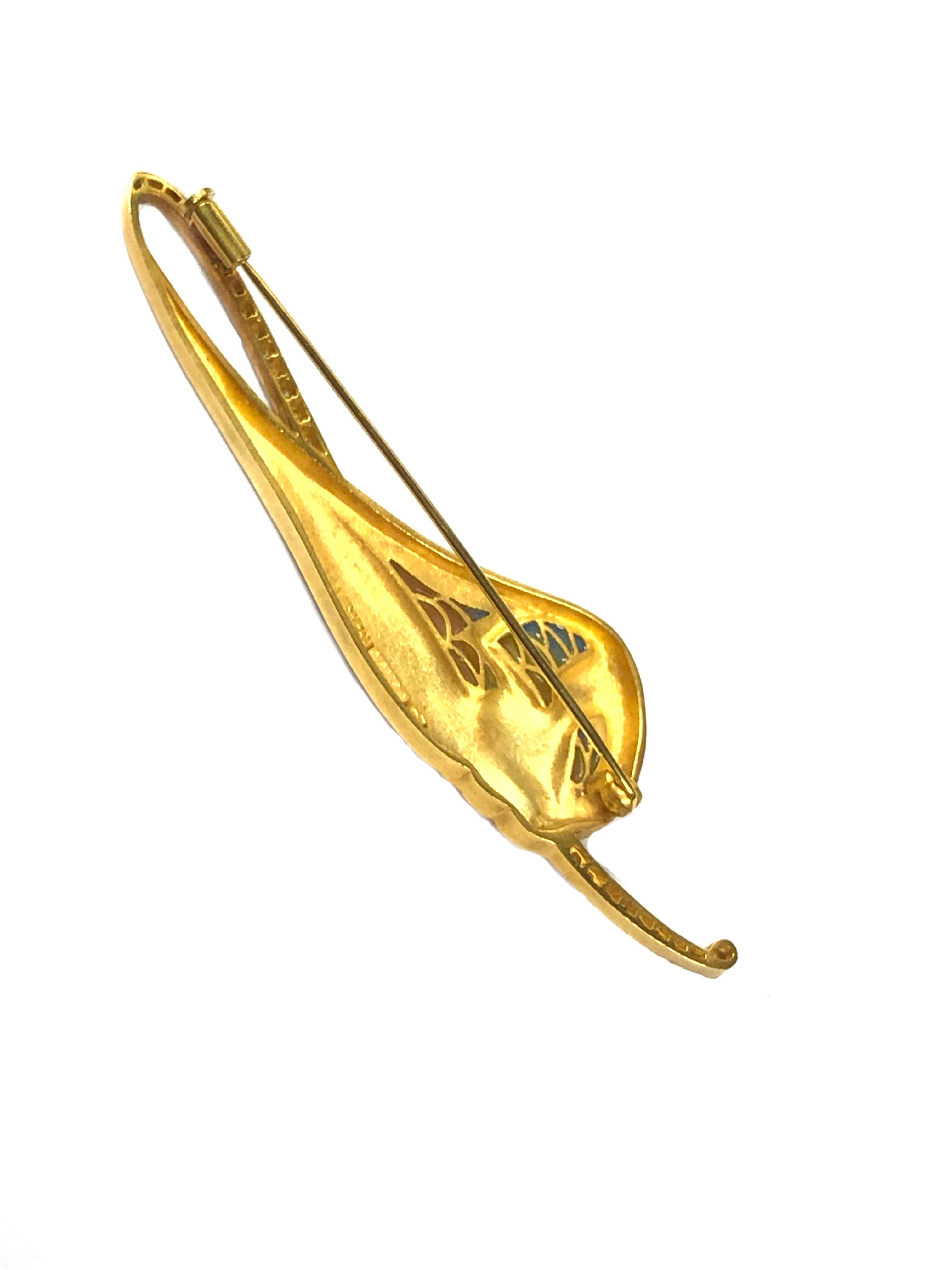 Circa 2000 Luis Masriera Spain, 18K Yellow Gold Art Nouveau Brooch, in the form of a reclining Woman and measuring 3 1/8 inches in length X 3/4 inch. Lightly frosted 18K yellow Gold finish with fine Opaline Enamel and colorful Plique Enamel. Further