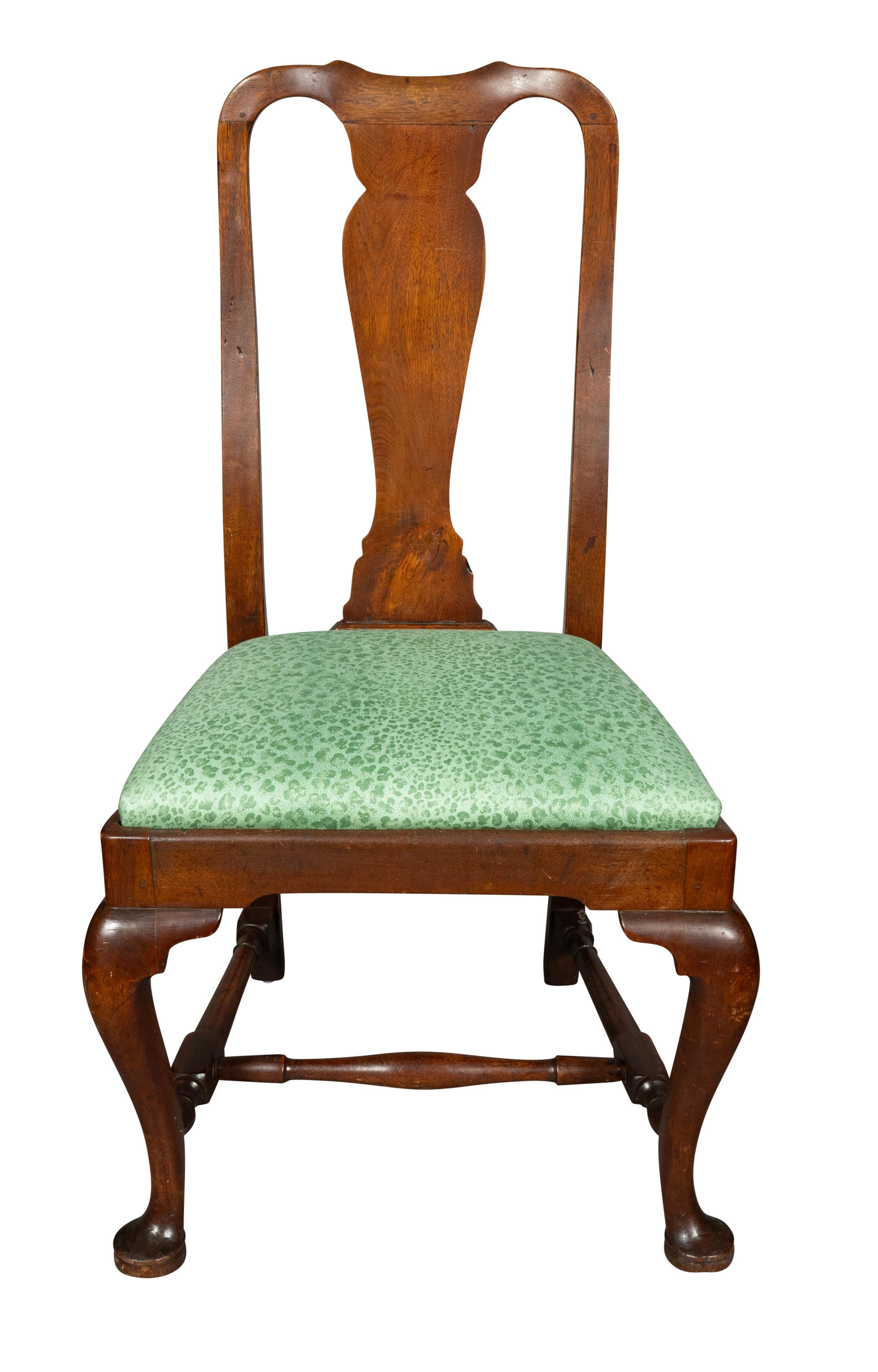 With oxbow crest rail and simple variform splat. Drop in seat and cabriole legs and joined by stretchers.