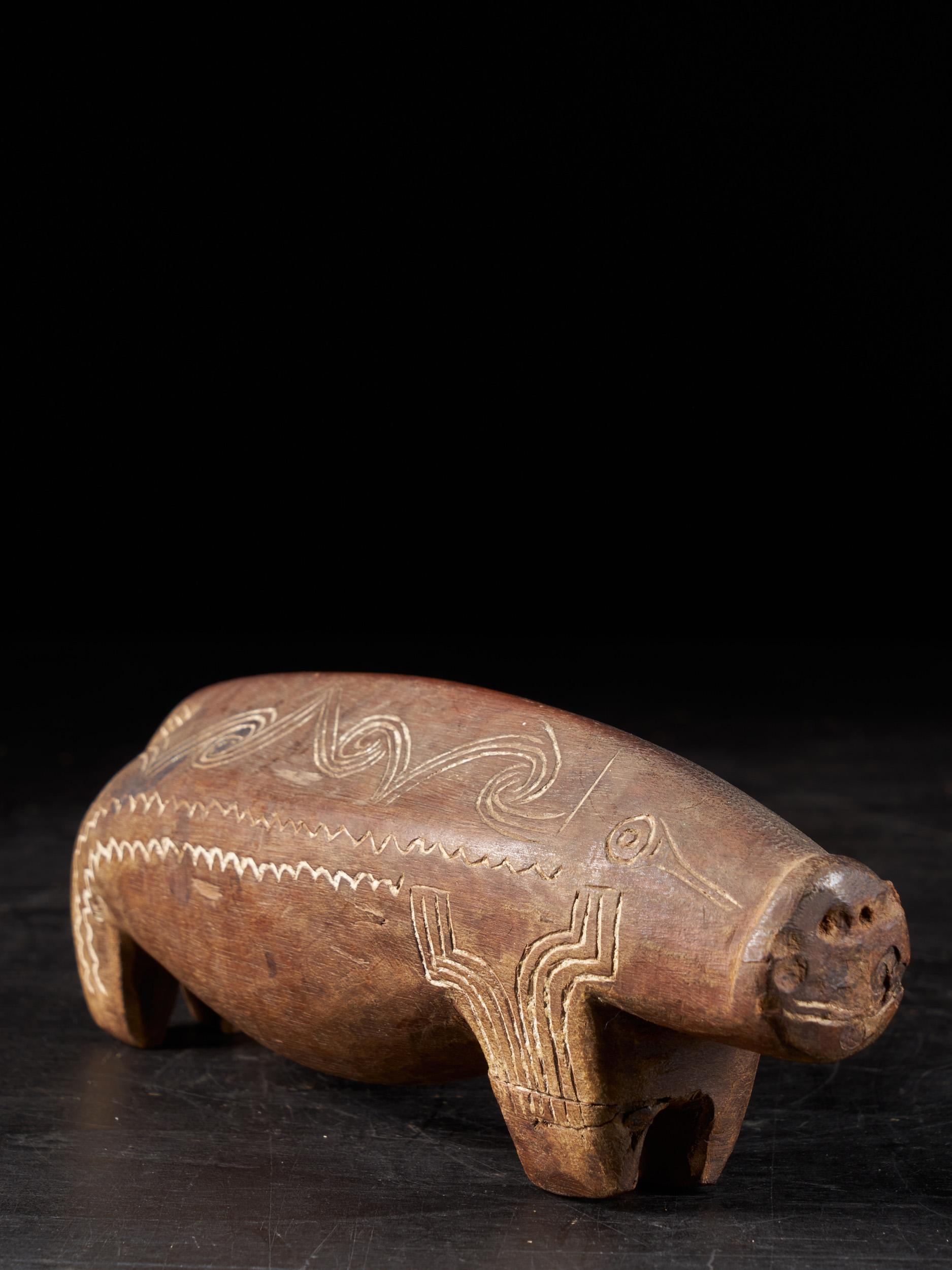 Hand-Carved Ethno Design Massim People, Trobiand Islands, Wooden Charm Pig Sculpture For Sale