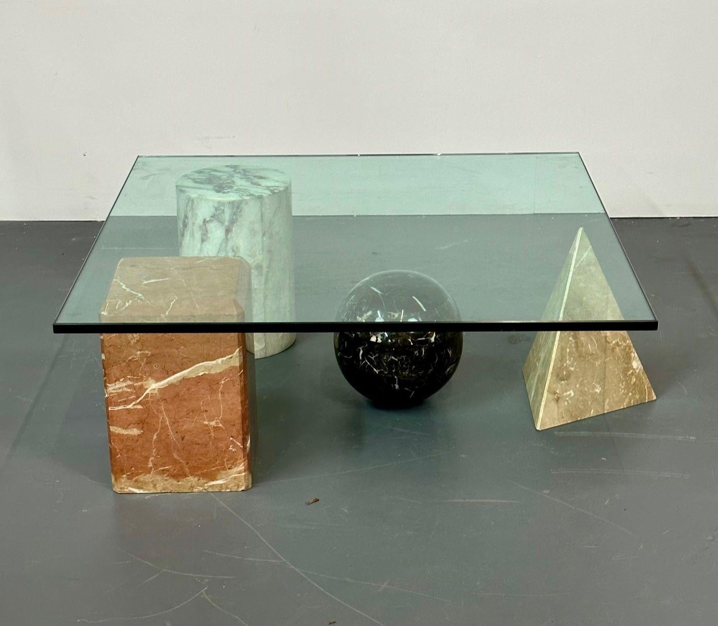 Massimo and Leila Vignelli style marble and glass coffee / low table, modern
A marble and glass top coffee table having four geometrical marble pieces being supported by three with a floating circle marble ball in the style of the metafora coffee