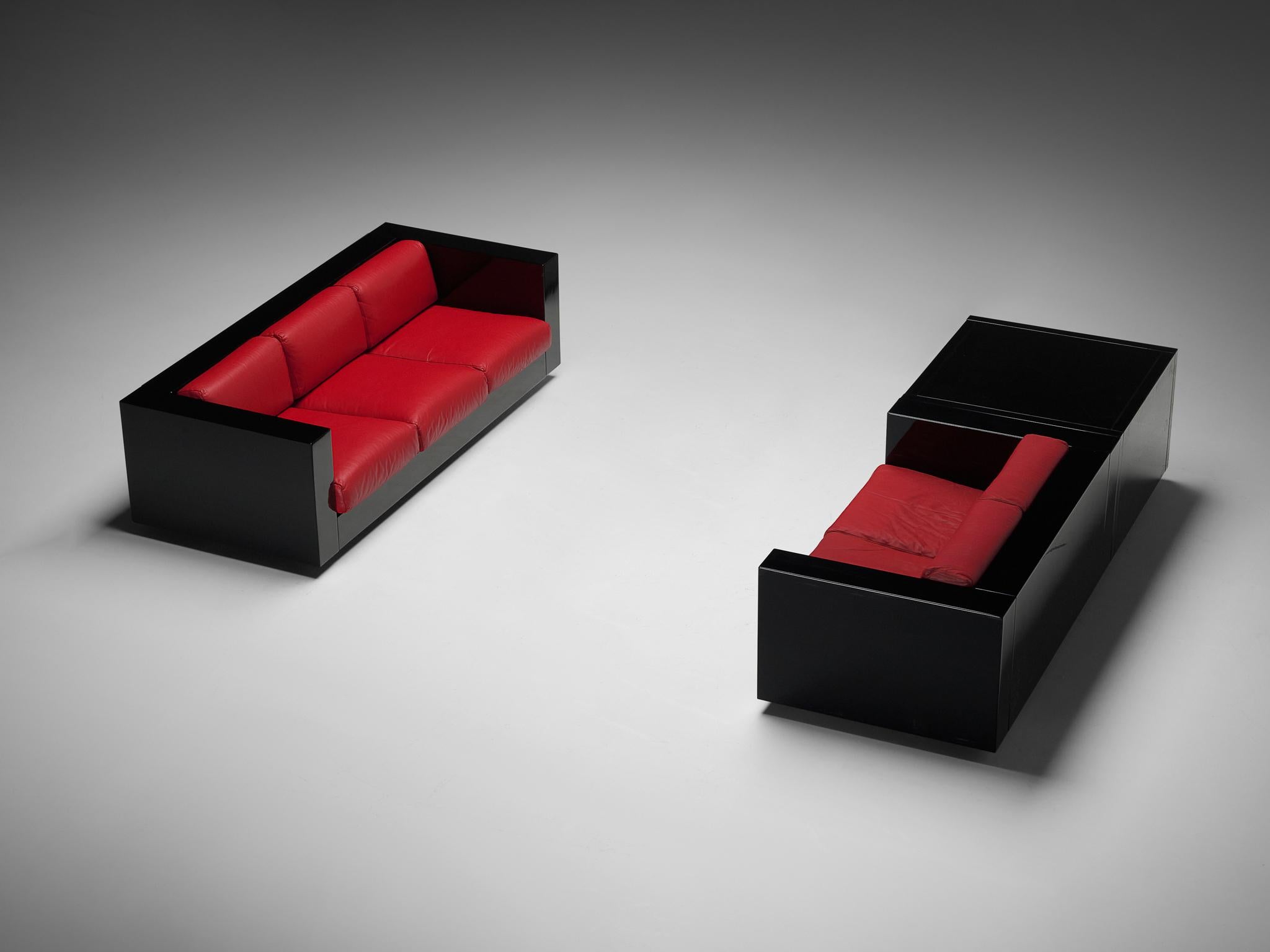 Massimo and Lella Vignelli for Poltronova 'Saratoga' living room set three-seat sofa, two-seat sofa, and cabinet, polyester lacquer and red leather, Italy, 1964.

Captivating lounge set or living room interior by Italian designer couple Lella &