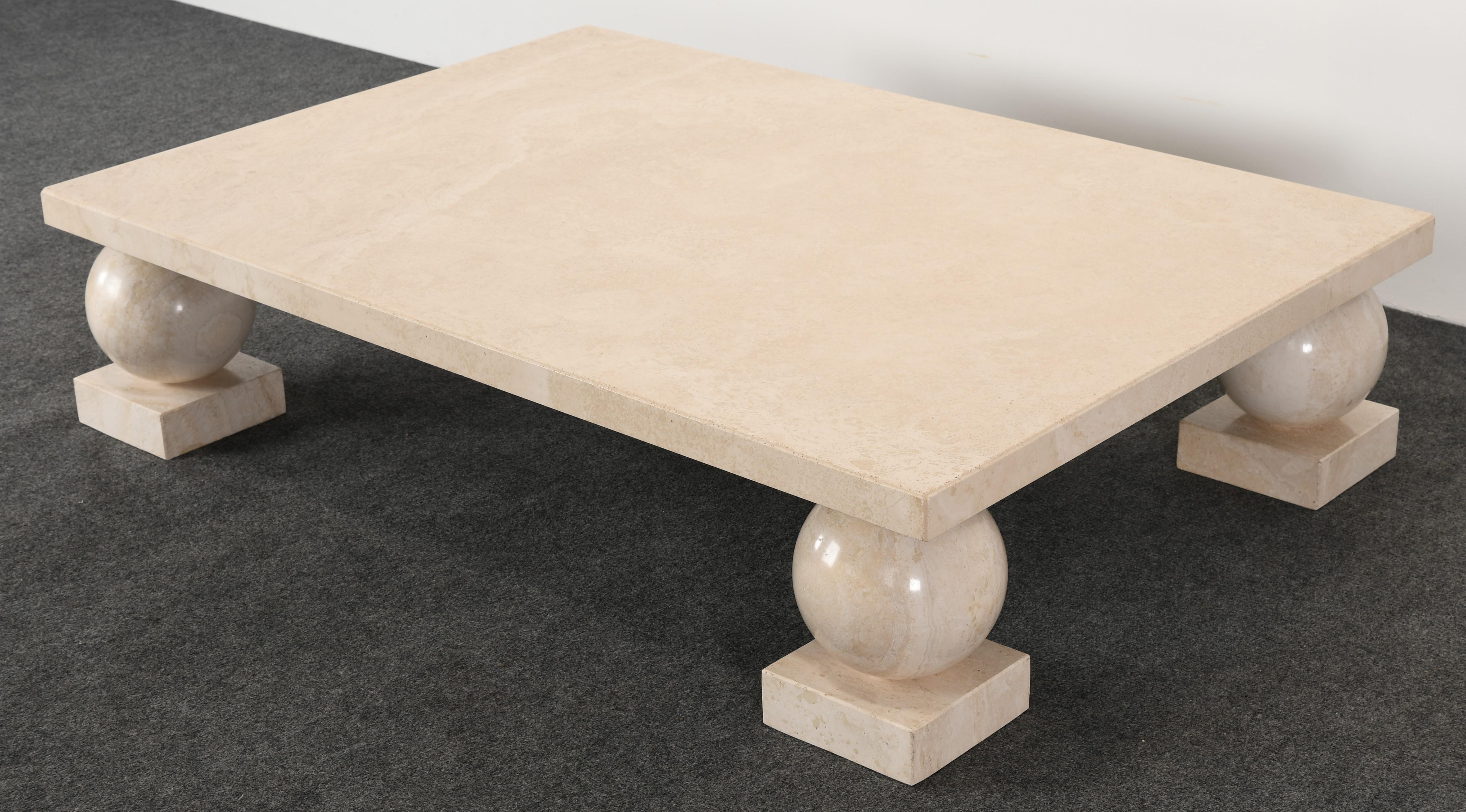A classical Roche Bobois or Massimo and Lella Vignelli style travertine marble coffee table. This Minimalist cocktail table or coffee table is mounted on four round legs. This table is structurally sound and in good condition.

Dimensions: 12
