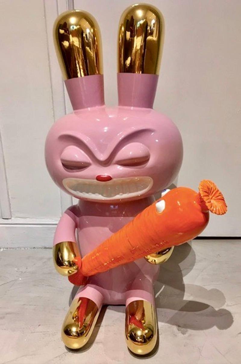 Limited edition earthenware sculpture in two pieces, representing a rabbit holding a carrot designed by Massimo Giacon. Polychrome ceramic from the collection “The pop will eat himself”. Produced by Superego, Italy. Artist's and producer's stamps