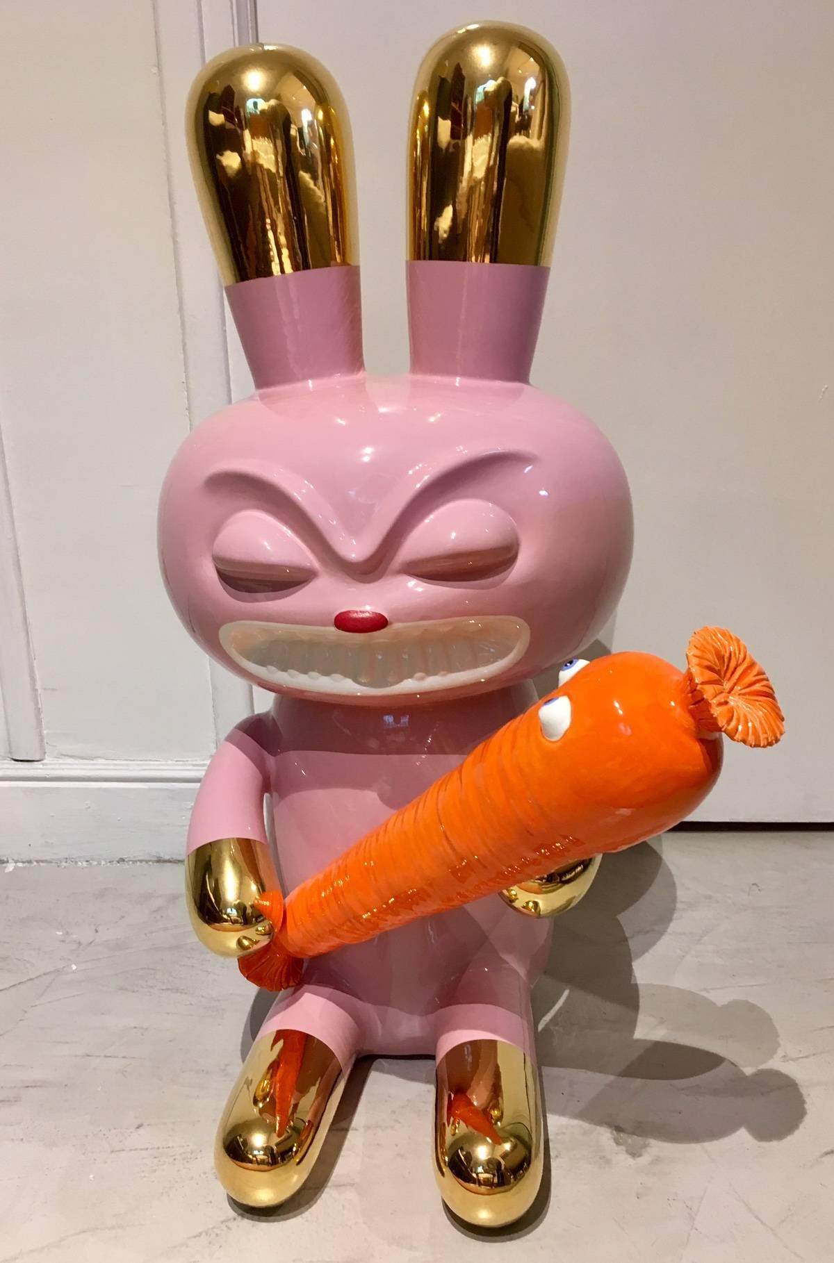 Limited edition earthenware sculpture in two pieces, representing a rabbit holding a carrot designed by Massimo Giacon. Polychrome ceramic from the collection “The pop will eat himself”. Produced by Superego, Italy. Artist's and producer's stamps