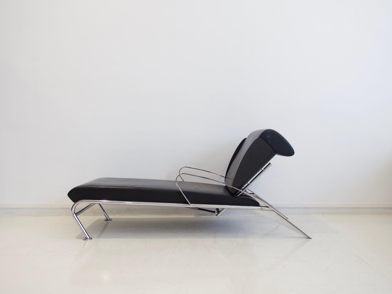 Chaise lounge designed by Massimo Iosa Ghini (born 1959) and manufactured by Moroso, Italian design of the 1980s. Adjustable construction made of chromed flat and round steel. Molded plywood shell in black lacquer and covers made of black leather.