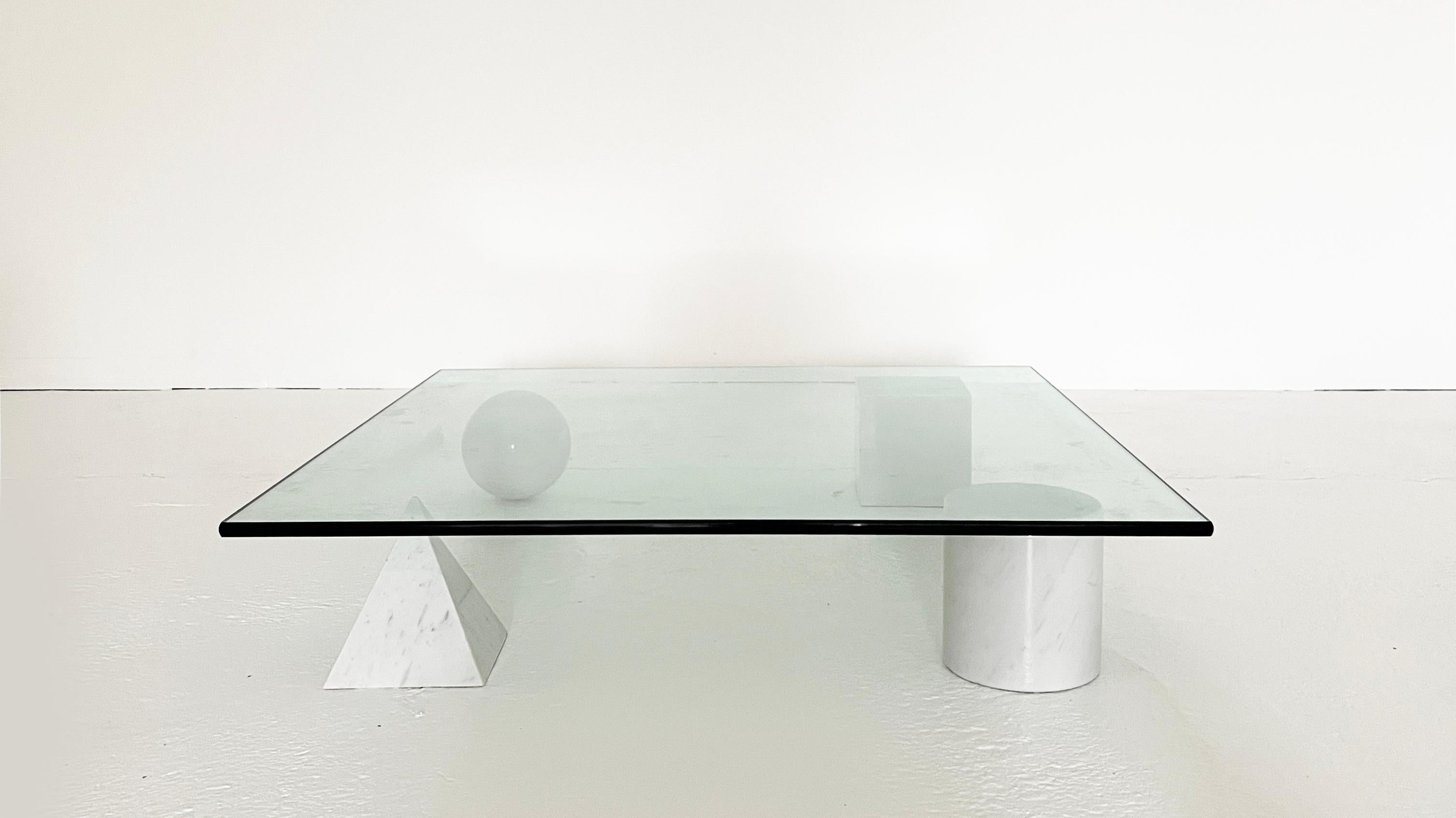 The four forms of the geometry, the cube, the cylinder, the sphere and the pyramid, made of white marble, represent the basis of the table finished with a heavy top sheet of transparent glass.

The four elements can be positioned freely,