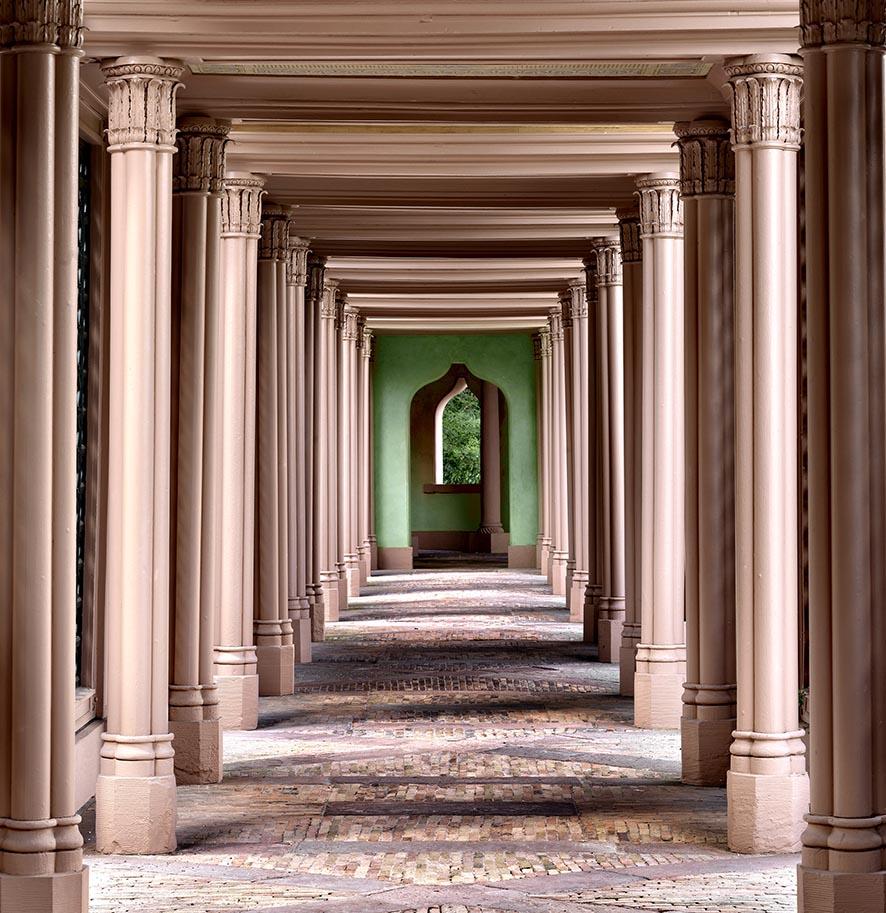 Massimo Listri Color Photograph - Schwetzingen Germania - doorframes with columns with green in the back 