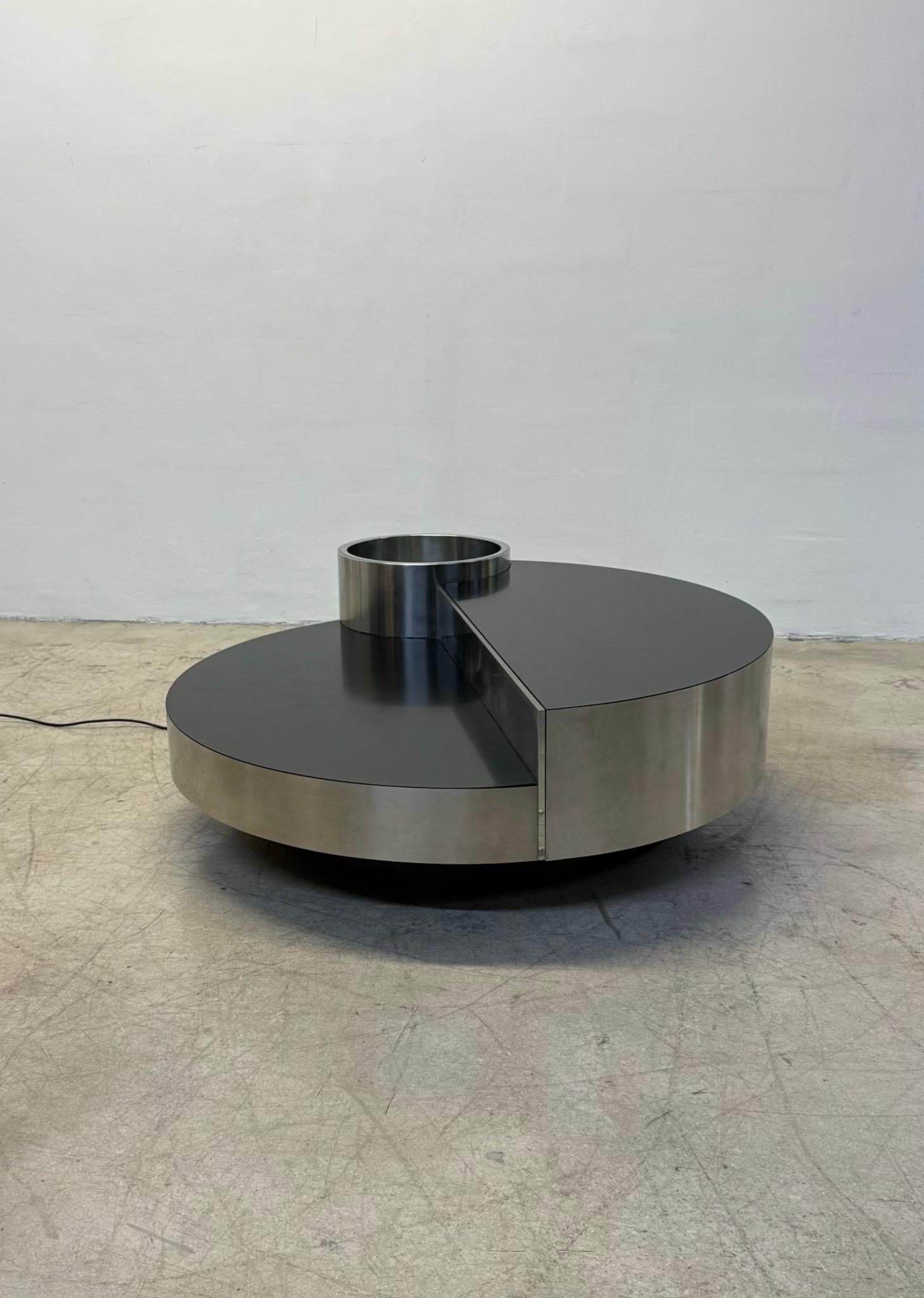Rare Harry’s Bar coffee or cocktail table designed by Massimo Papiri for Mario Sabot circa 1970s.  

The coffee table consists of two black melamine surfaces on different levels with a transparent lucite divider. There is a large stainless steel ice