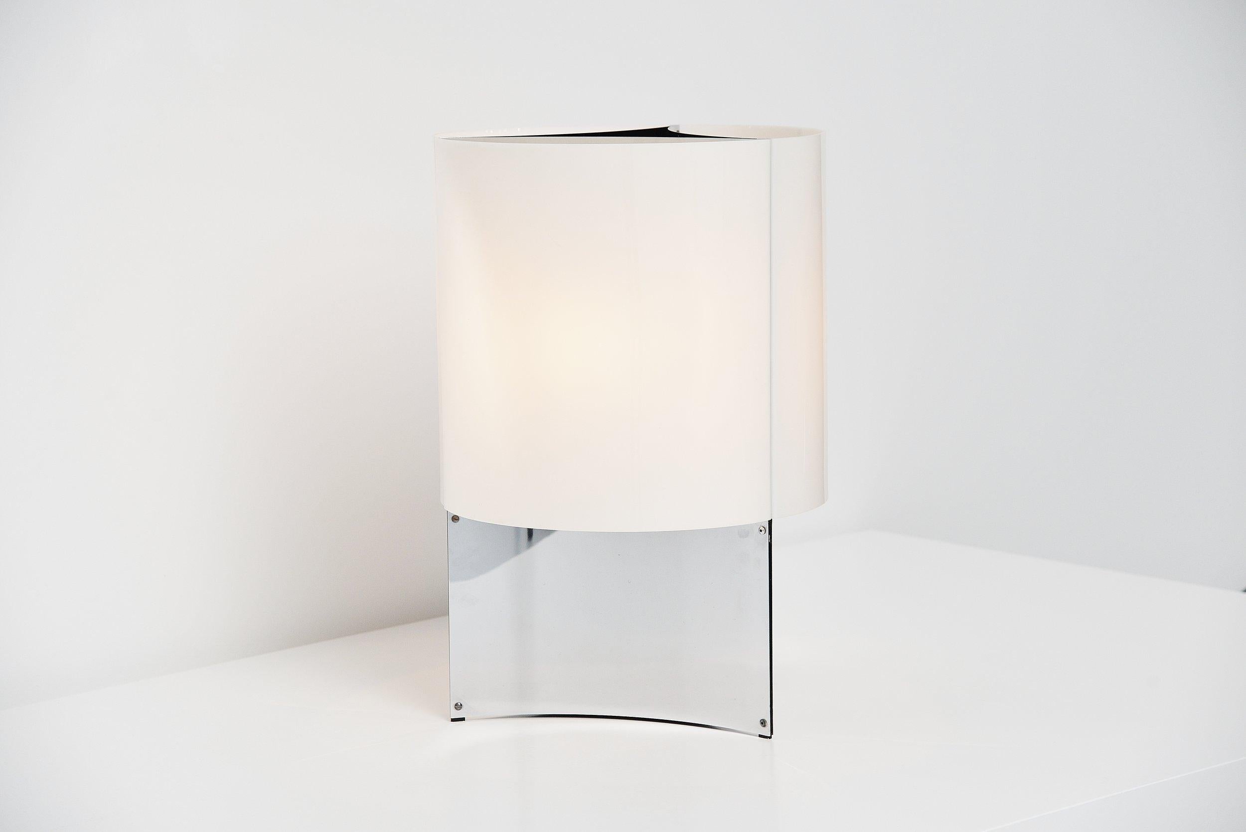 Large table or floor lamp model 526/G designed by Massimo Vignelli for Arteluce, Italy, 1965. This monumental lamp has a chrome-plated metal base and a white plexi shade that gives very nice light when lit. The lamp is in fantastic original