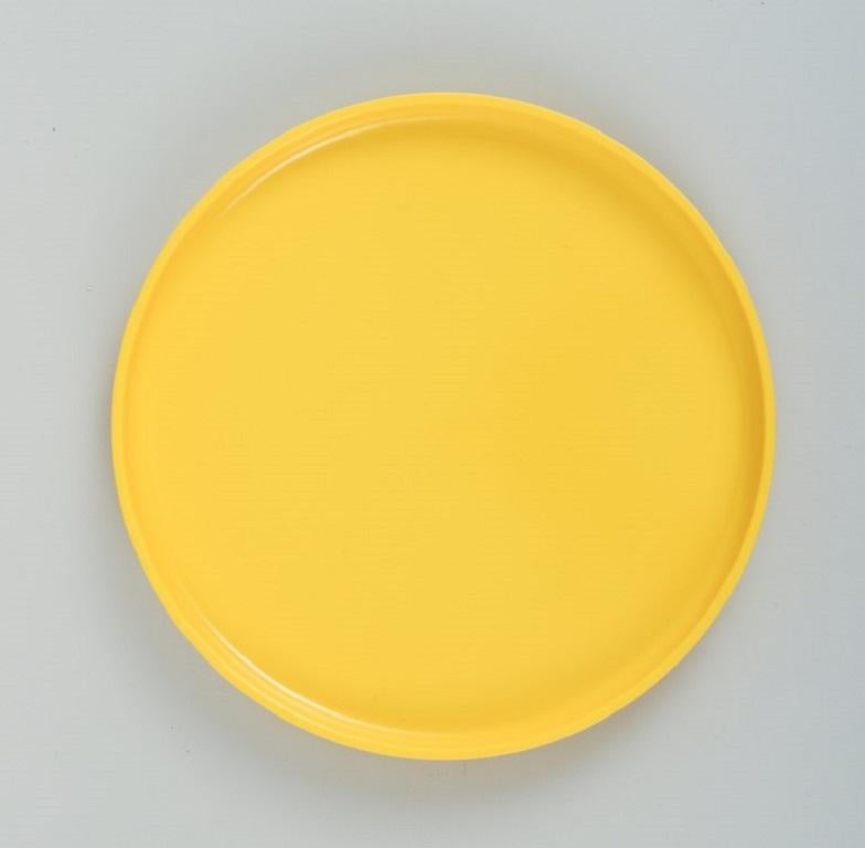 Massimo Vignelli for Heller, Italy.
A set of 4 plates in yellow melamine.
1970/80s.
Stackable.
In excellent condition.
Marked.
D 19,5 x H 2,0 cm.
 