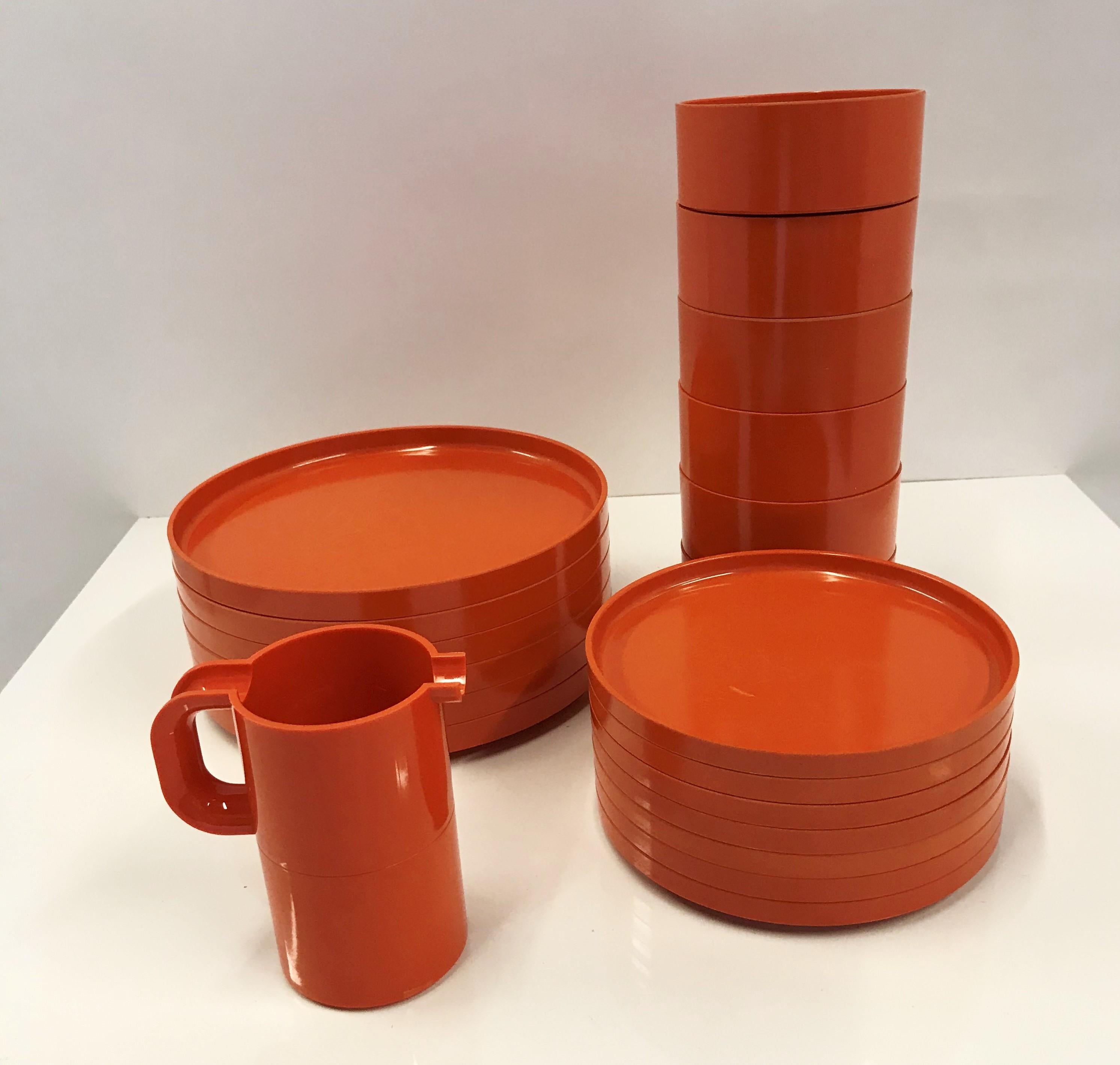 Designed by Massimo and Lella Vignelli for Heller in 1964, a set of 22 dinnerware pieces for 6 in fun Orange. They were originally manufactured in Italy until 1971 when production moved to the United States. All pieces of this dinnerware were made