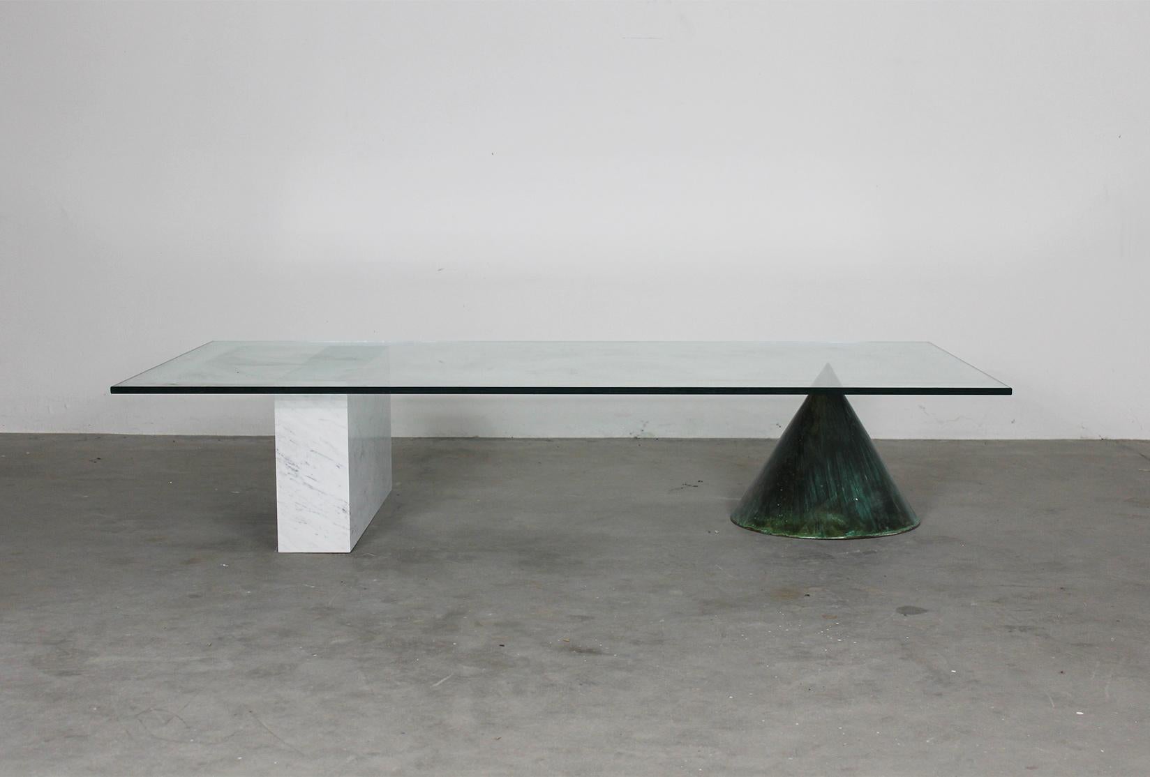 Kono coffee table designed by Massimo Vignelli and manufactured by Casigliani in 1980s.
Low table with supports in oxidized copper and white Carrara marble and ground glass on top.

