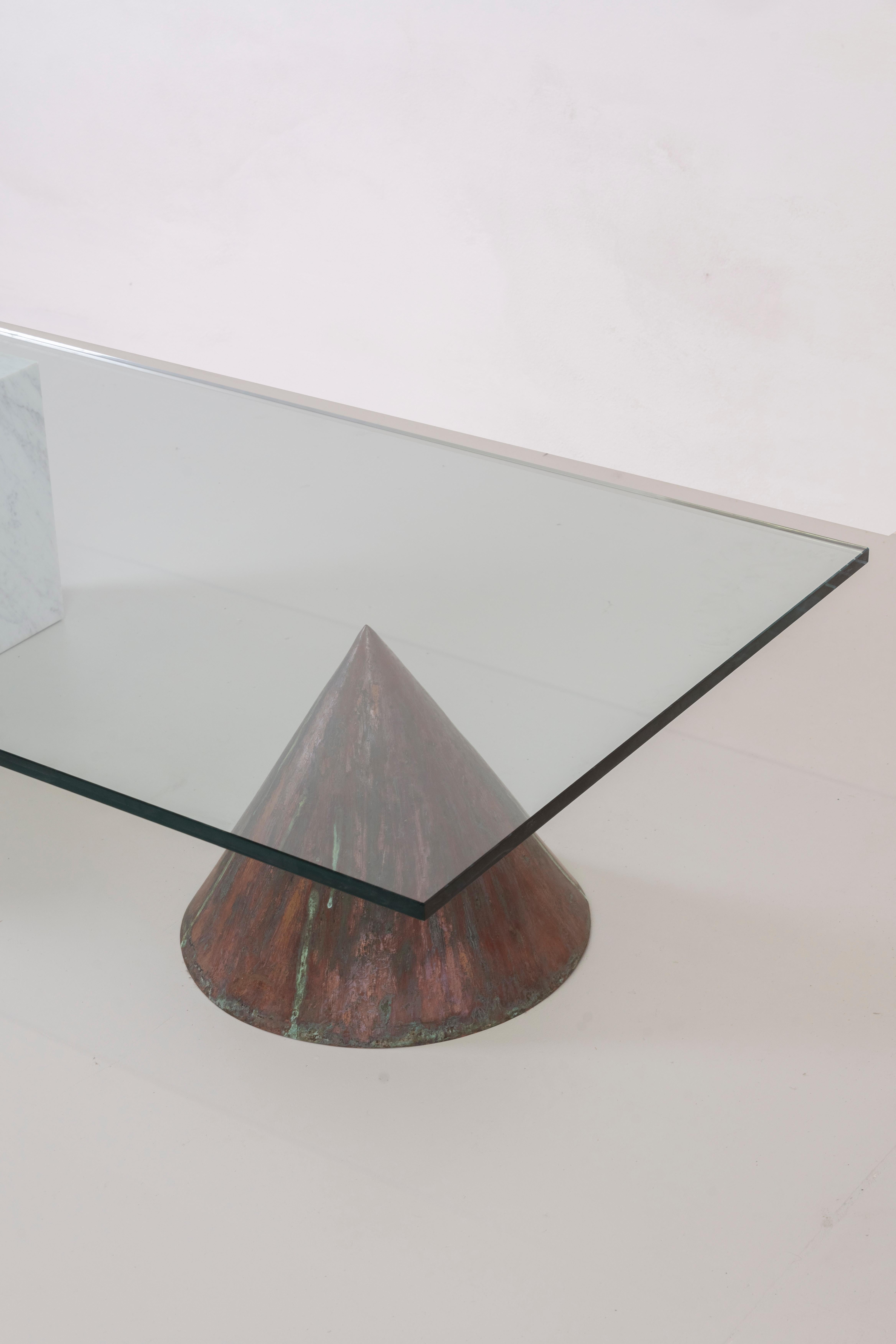 Kono coffee table designed by Massimo Vignelli and manufactured by Casigliani in 1970s.
Low table with supports in oxidized copper and white Carrara marble and ground glass on top.

Lella & Massimo Vignelli are two Italian designers internationally