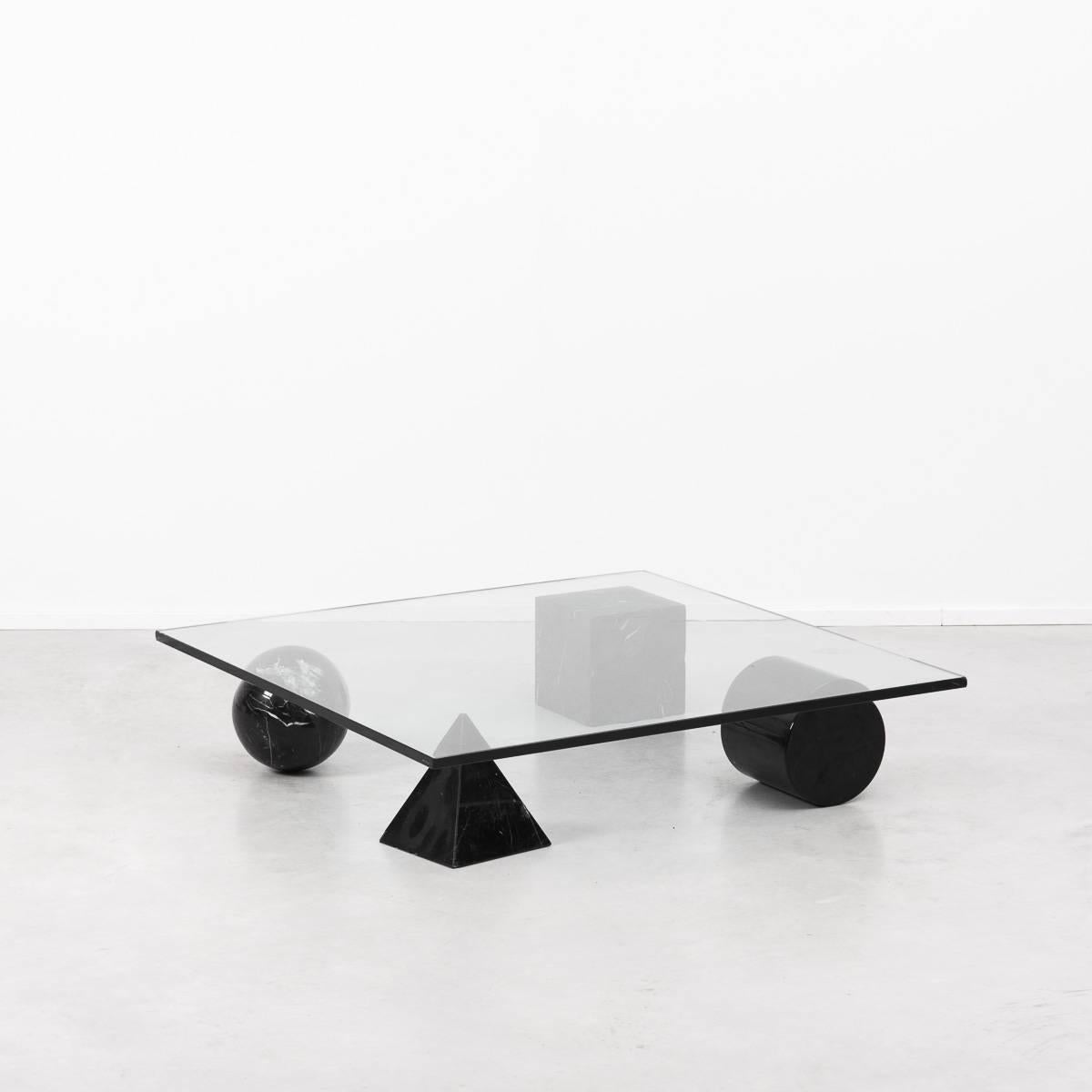 A stunning and sculptural coffee table inspired by the four forms of Euclidean geometry, the cube, the pyramid, the cylinder and the sphere. The four elements can be positioned freely for a unique composition. 
The elements are made from black