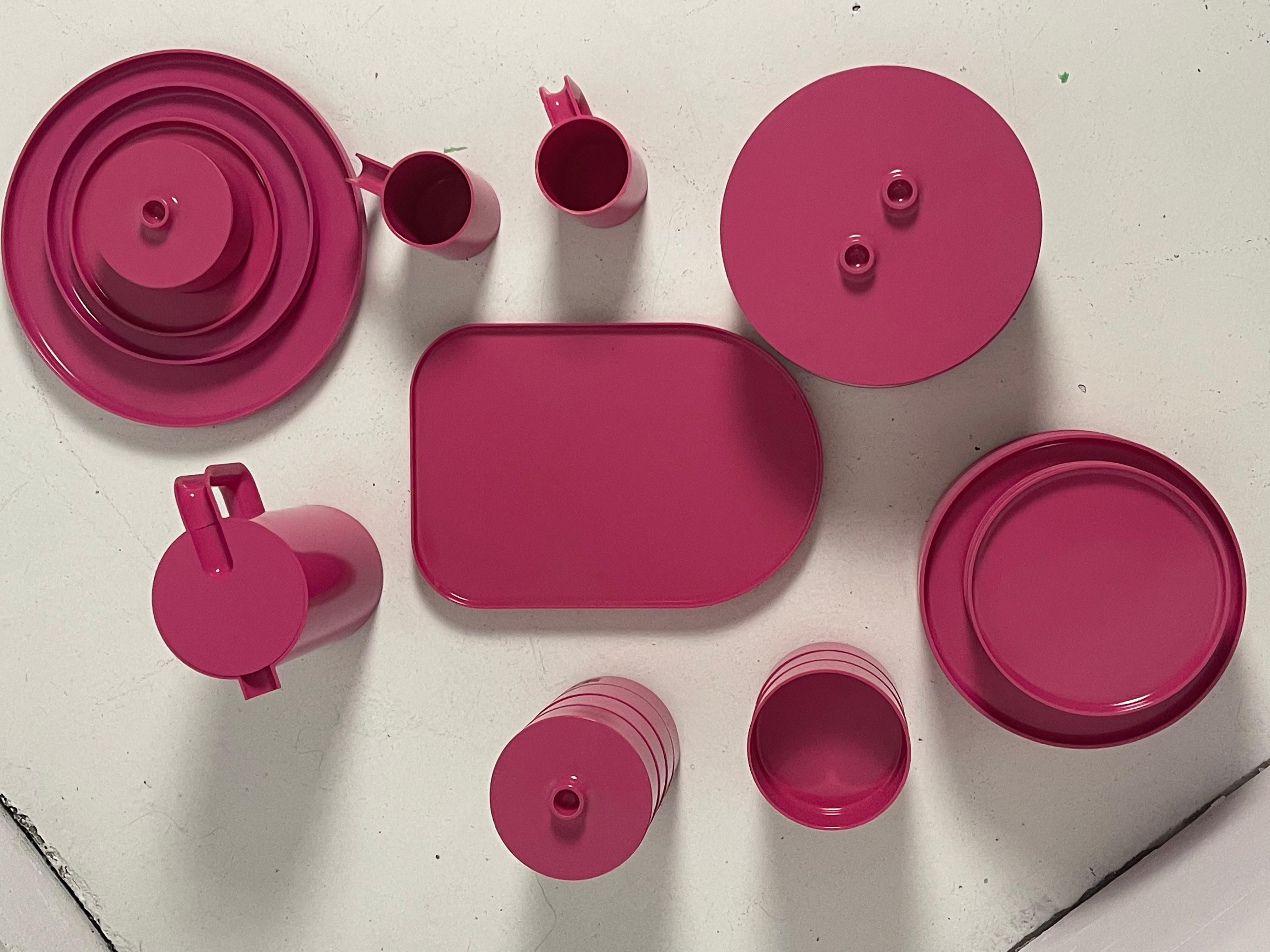 31 piece stackable dining set by Massimo Vignelli for Heller, 1964. Innovative and versatile design in a  rare and vibrant pink plastic. Purple set also available.