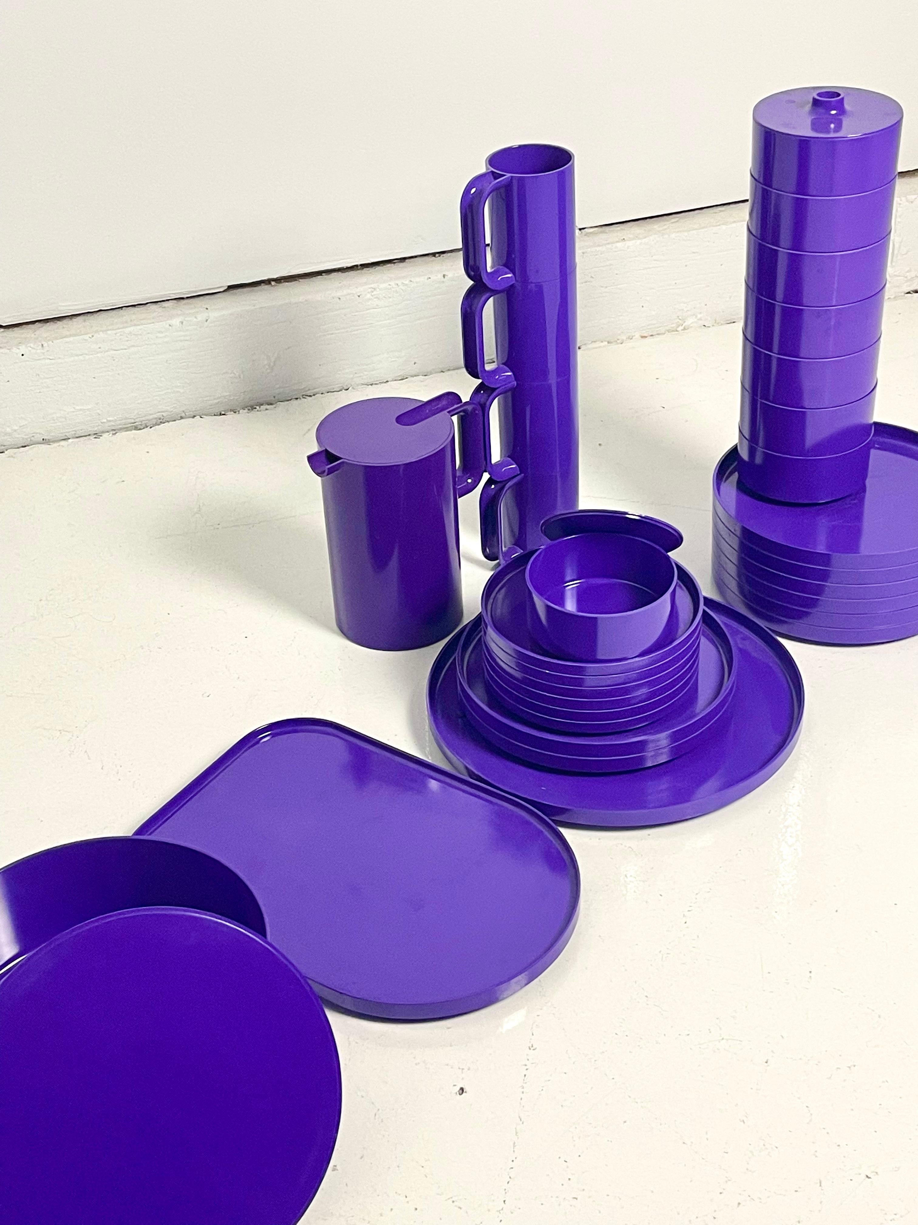 33 Piece stackable dinnerware setup by Massimo Vignelli for Heller, 1964 in a vibrant, and rare, purple plastic. Impeccable space saving design gives this versatile set endless possibilities. Pink set also available.