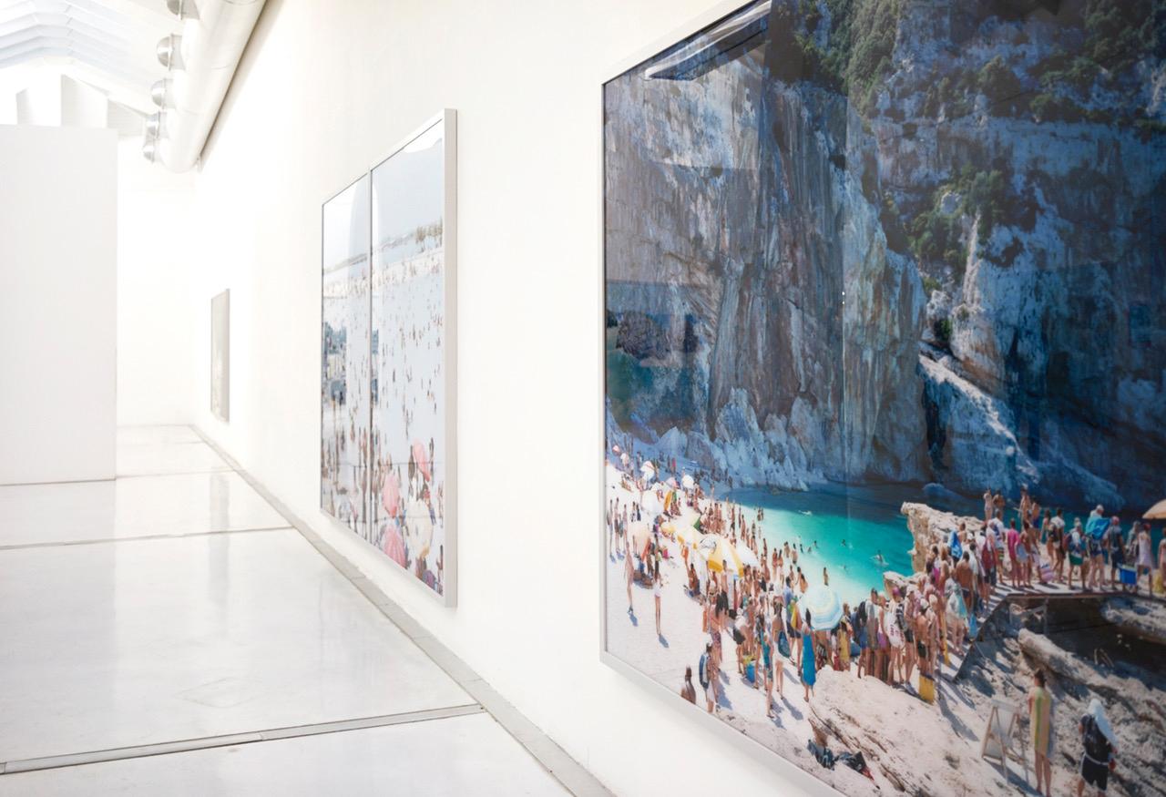 iconic large format beach photograph by Italian photographer Massimo Vitali, renowned for his grand scale topographical observations of the rites and rituals of modern leisure

Praia do Moinho Handstand (2016) 
framed  61.25” x 80.95” / 155.60 cm x