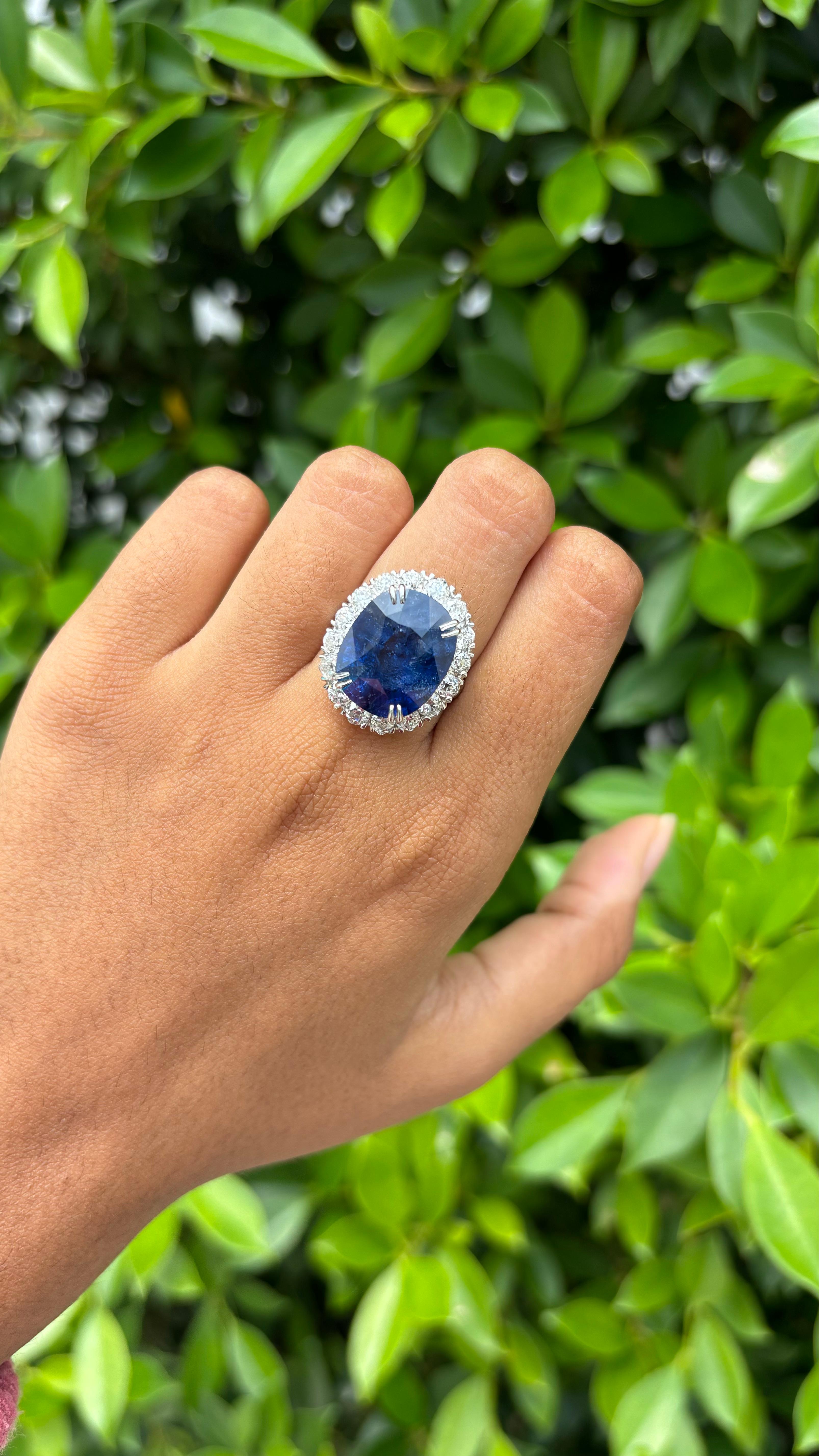 Introducing our magnificent Sapphire Ring, that weighs a whopping 13.32 Carat! The Sapphire is cut to perfection in an oval-shape and originates from  Sri Lanka, boasting a rich royal blue hue that evokes sophistication and allure. It has only