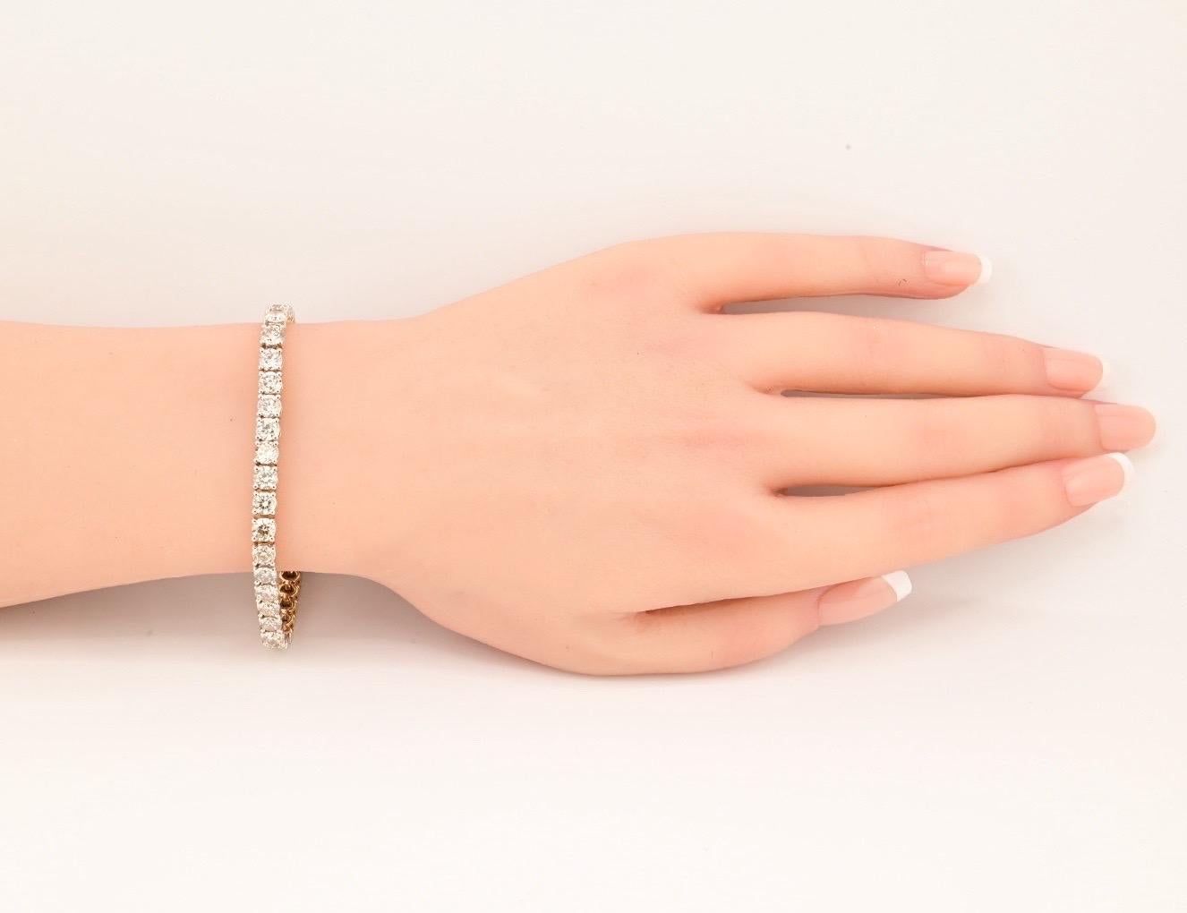 This exquisite bracelet features a stunning 13.90 carats of natural diamonds set in 18k yellow gold. The diamond has exceptional VS clarity, adding to the overall brilliance of the piece. The tennis style and white gold metal make it a classic and