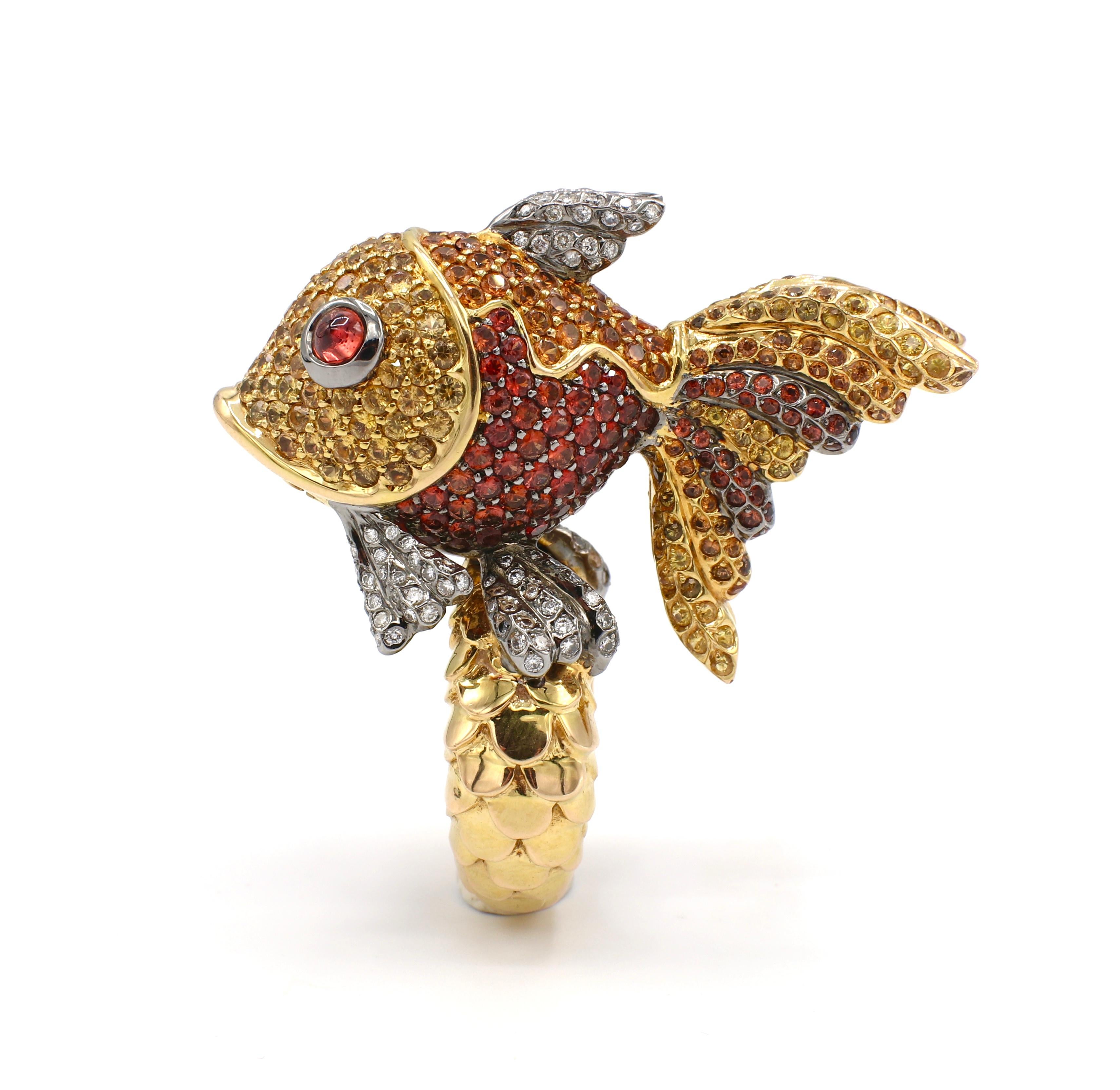 Massive 18K Yellow Gold Citrine, Garnet & Diamond Fish Cocktail Ring Size 7

Metal: 18k yellow gold
Weight: 43.7 grams 
Diamonds: Approx. 0.75 CTW G-H VS
Fish measures approx. 50mm x 35mm 
Band is 7mm wide at base
Signed: 