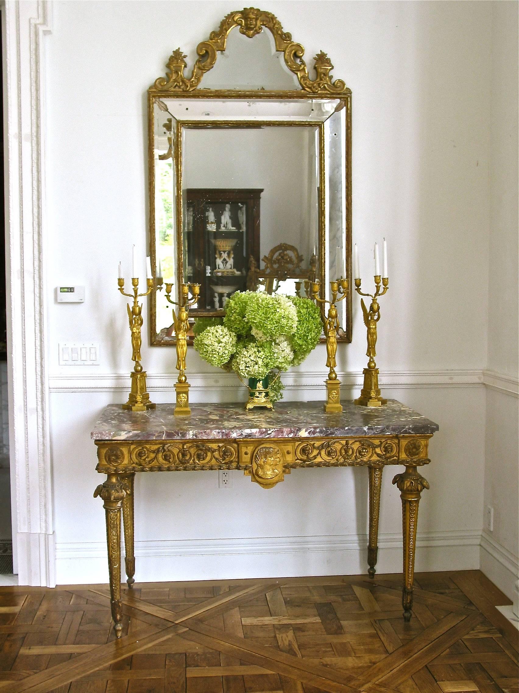 Rare Agrarian inspired neoclassical console table. Italian, original marble slab top. Profile plaque of two women, possibly the owners of the villa from which the table came. Side roundel of wheat indicating County Tuscan Villa Engaged in Grain