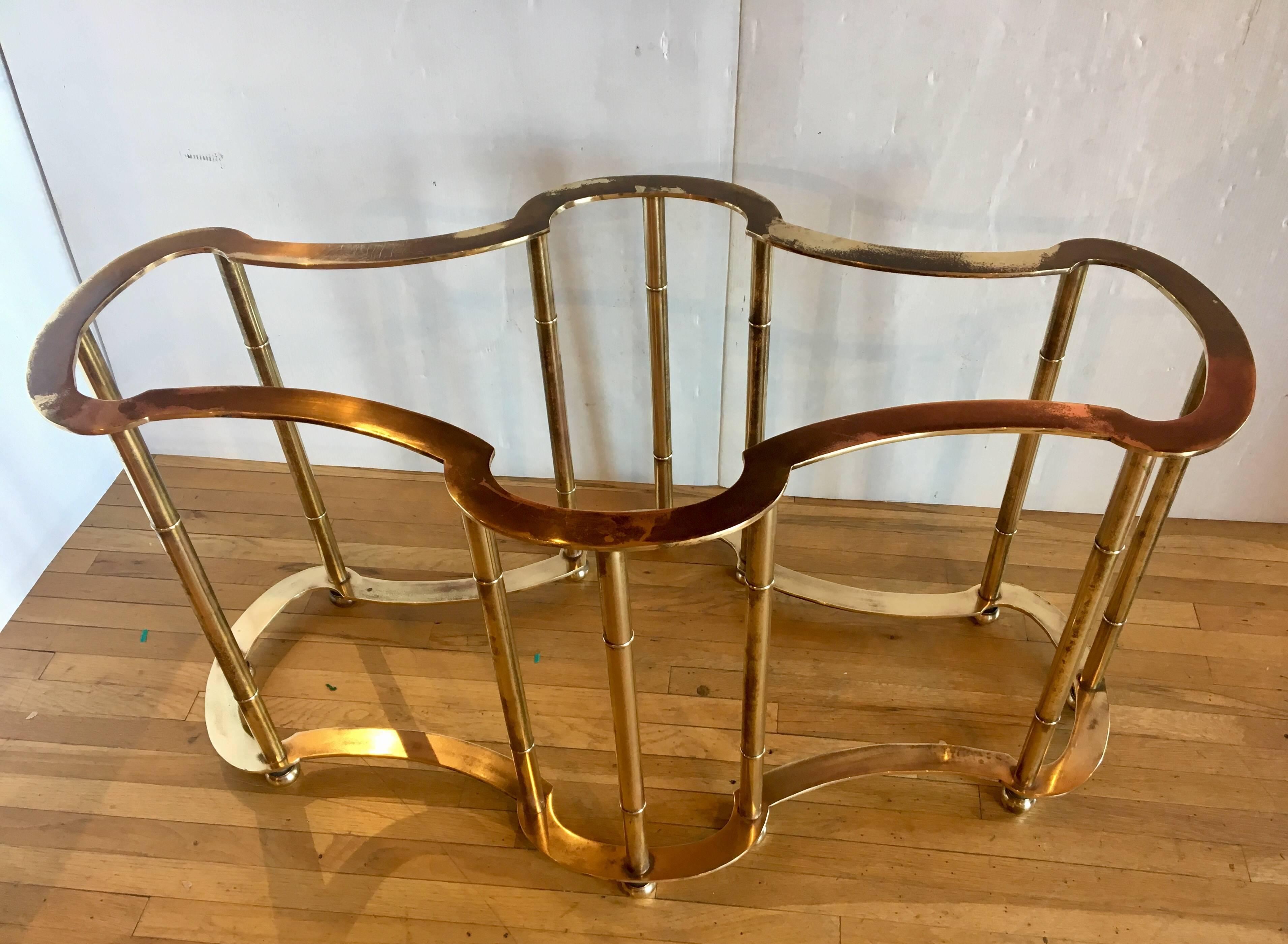 Beautiful polished brass racetrack dining table base by Mastercraft, circa 1960s. Polished brass with some patinated areas, incredible detail, massive and heavy; it can support a large piece of glass (rectangle or oval) or even a slab of marble as a