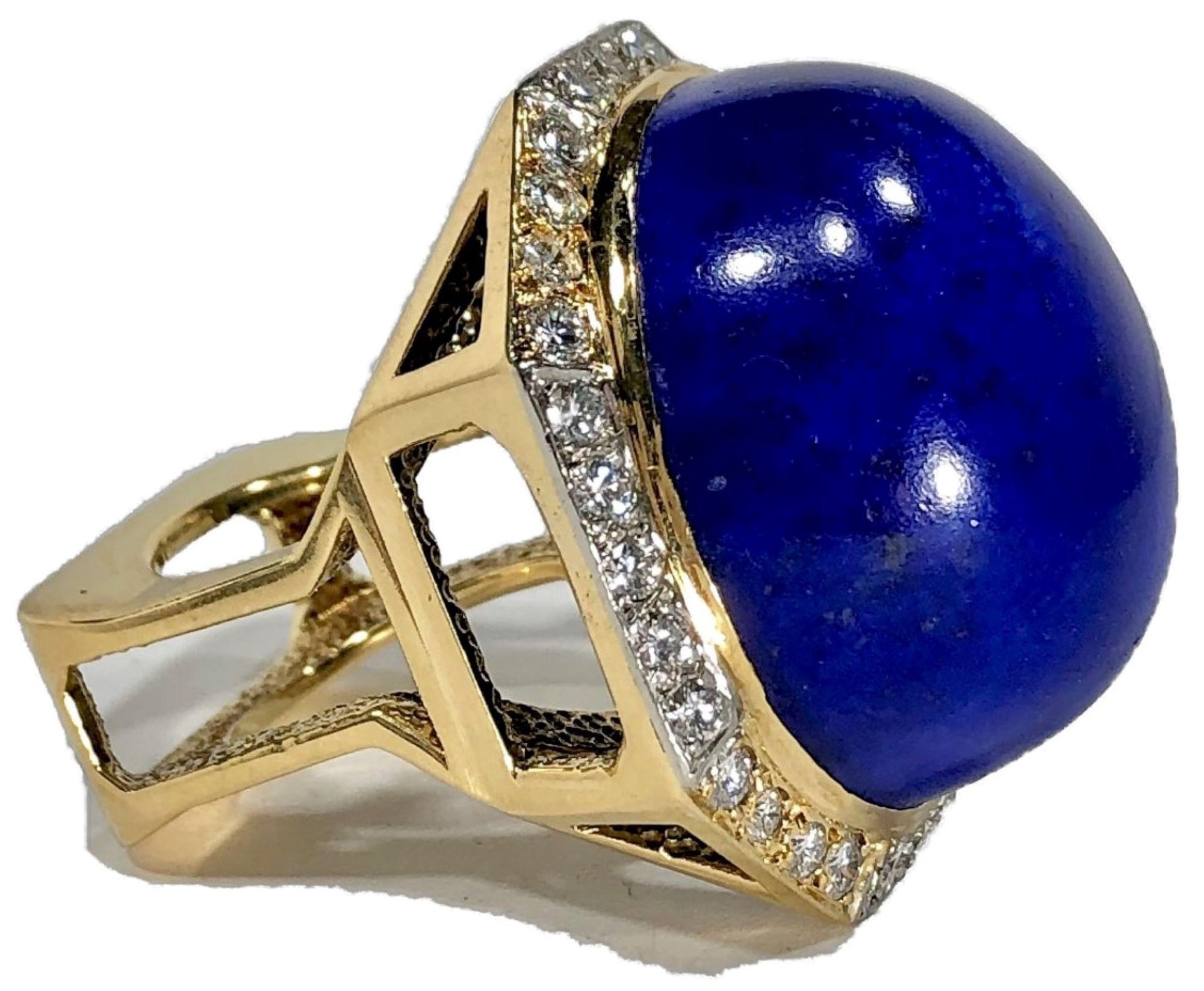 This 1970's cocktail ring can best be described as massive, impressive and iconic. Crafted from 18k yellow gold with all diamonds set in 18k white gold plates, It measures 
1  5/16 inches long by 1 3/16 inches wide. The enormous rich blue Lapis
