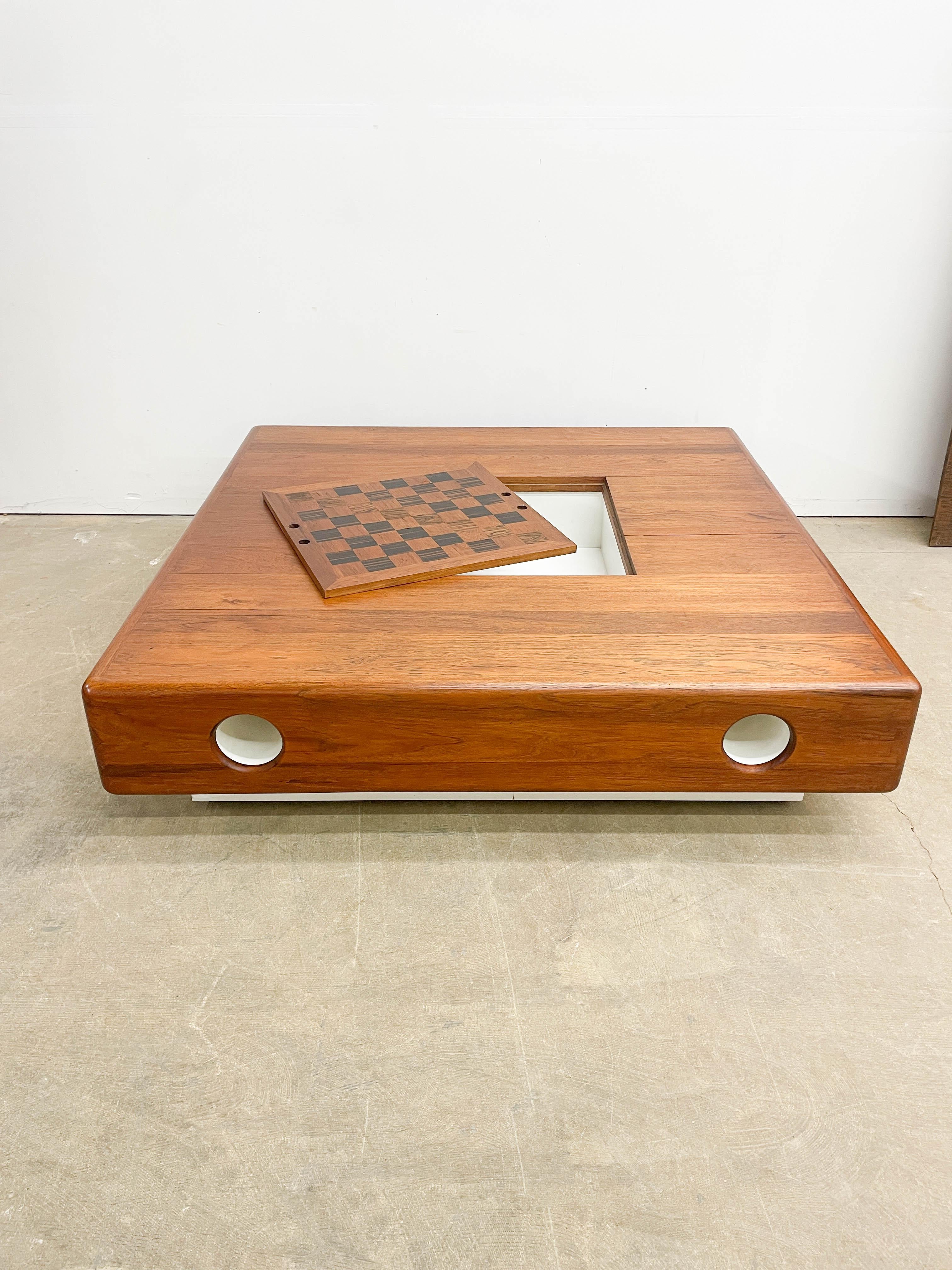 Stunning 1970s Danish conversation pit table from a Detroit mid century modern home. This huge teak platform floats on casters and is definitely not your everyday coffee table! Standing 60