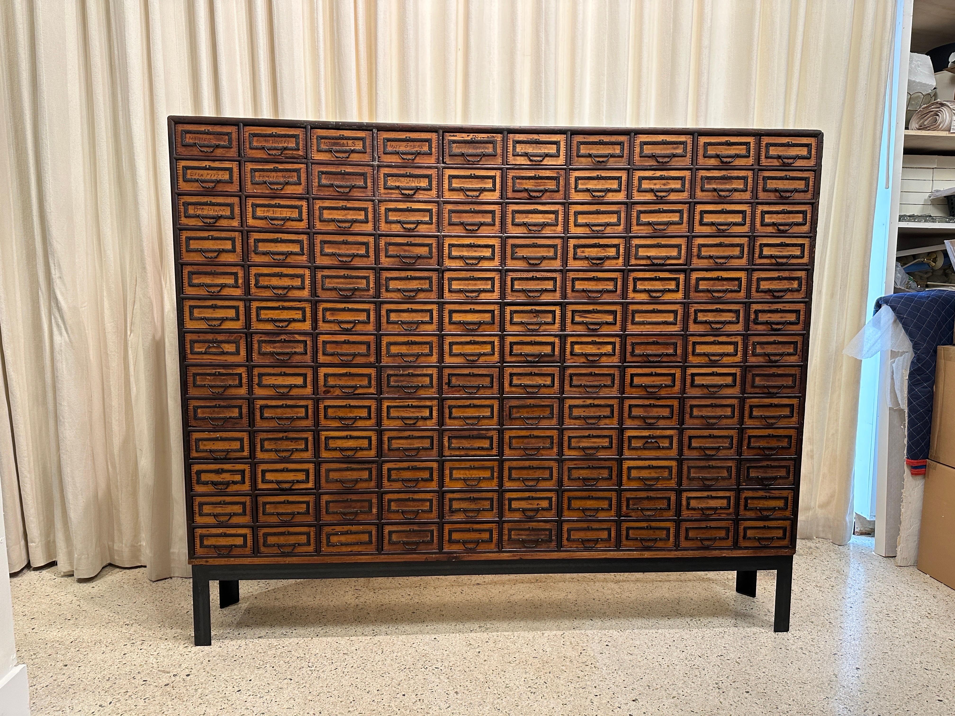 This wonderful 19th century English Apothecary cabinet with 130 ample working drawers was most recently used for categorizing music info.  There are pencil written names of various composers and we have left it completely as-found. 
 Solid wood to