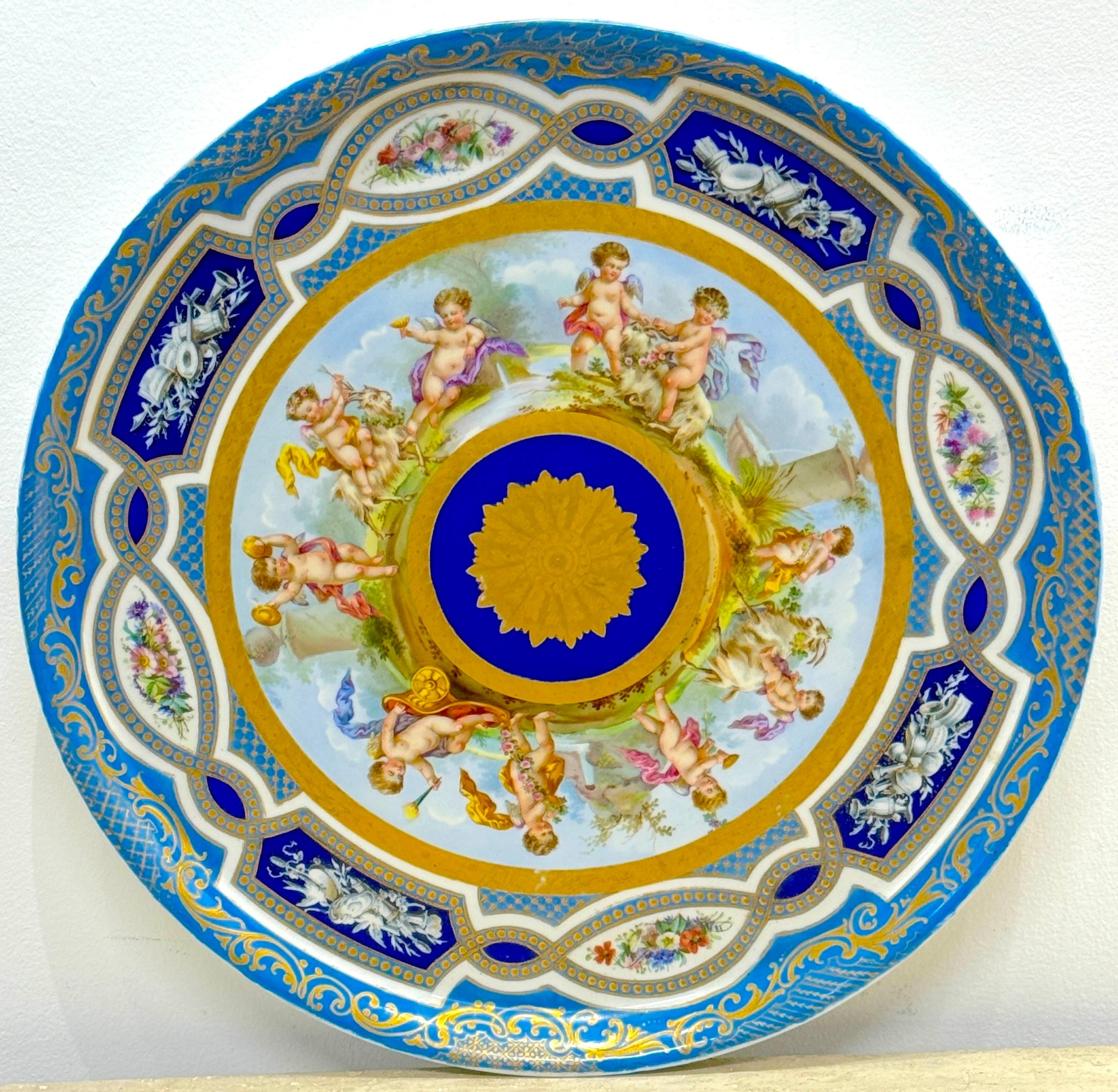 Massive 19th Century Sèvres Porcelain 'Labors of Cupid' Circular Tray
France, 1870s, with blue painted interlaced 'L's' underglaze mark

This massive 19th-century Sèvres porcelain 'Labors of Cupid' circular tray, made in France in the 1870s, is a