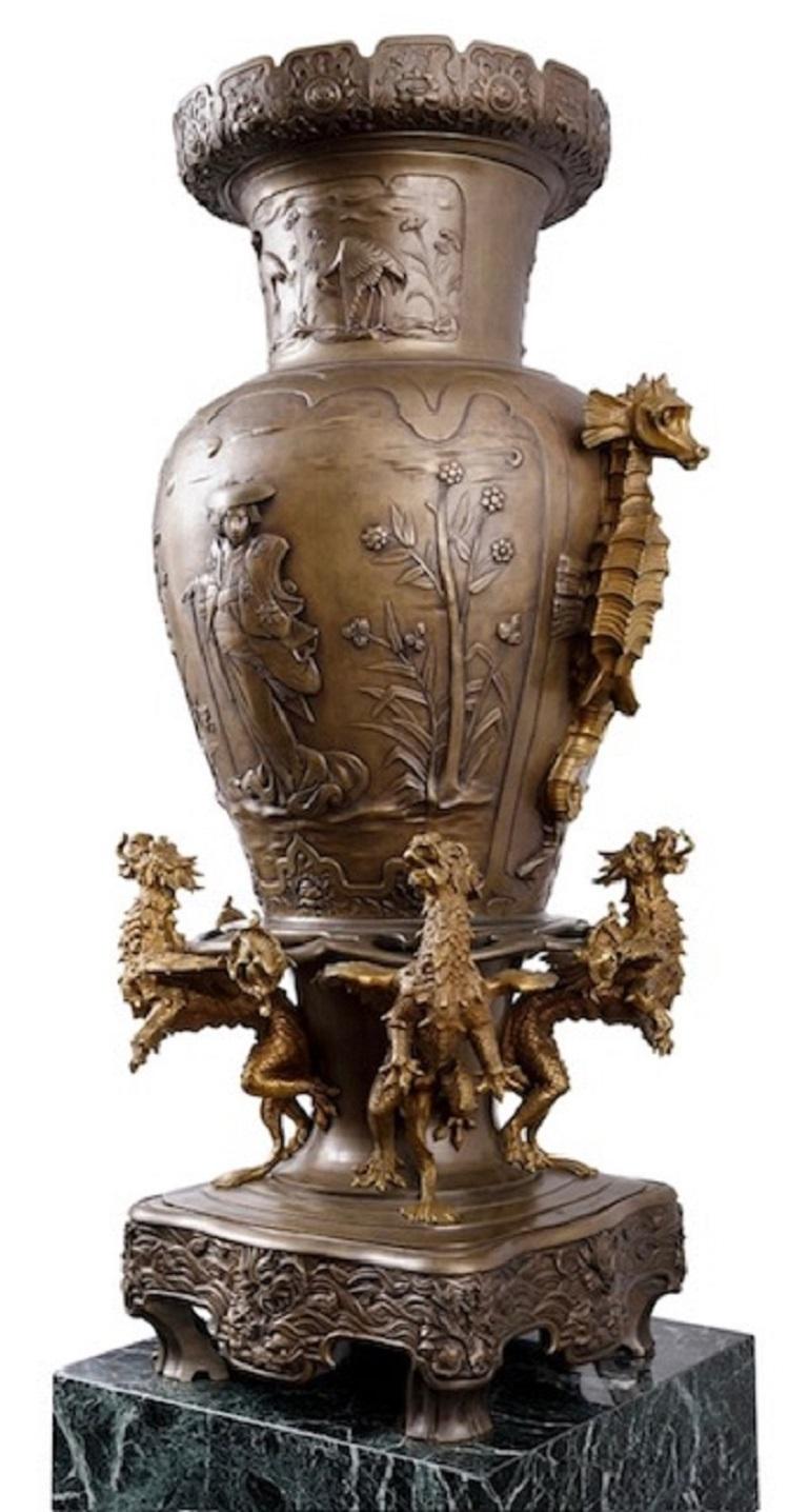 This exquisite and monumental unique pair of identical vases designed in Japanese style, are adorned with delicate floral motifs, elegant stilt birds, and graceful Geishas. Each base is encircled by four dragons, while the handles take on the form
