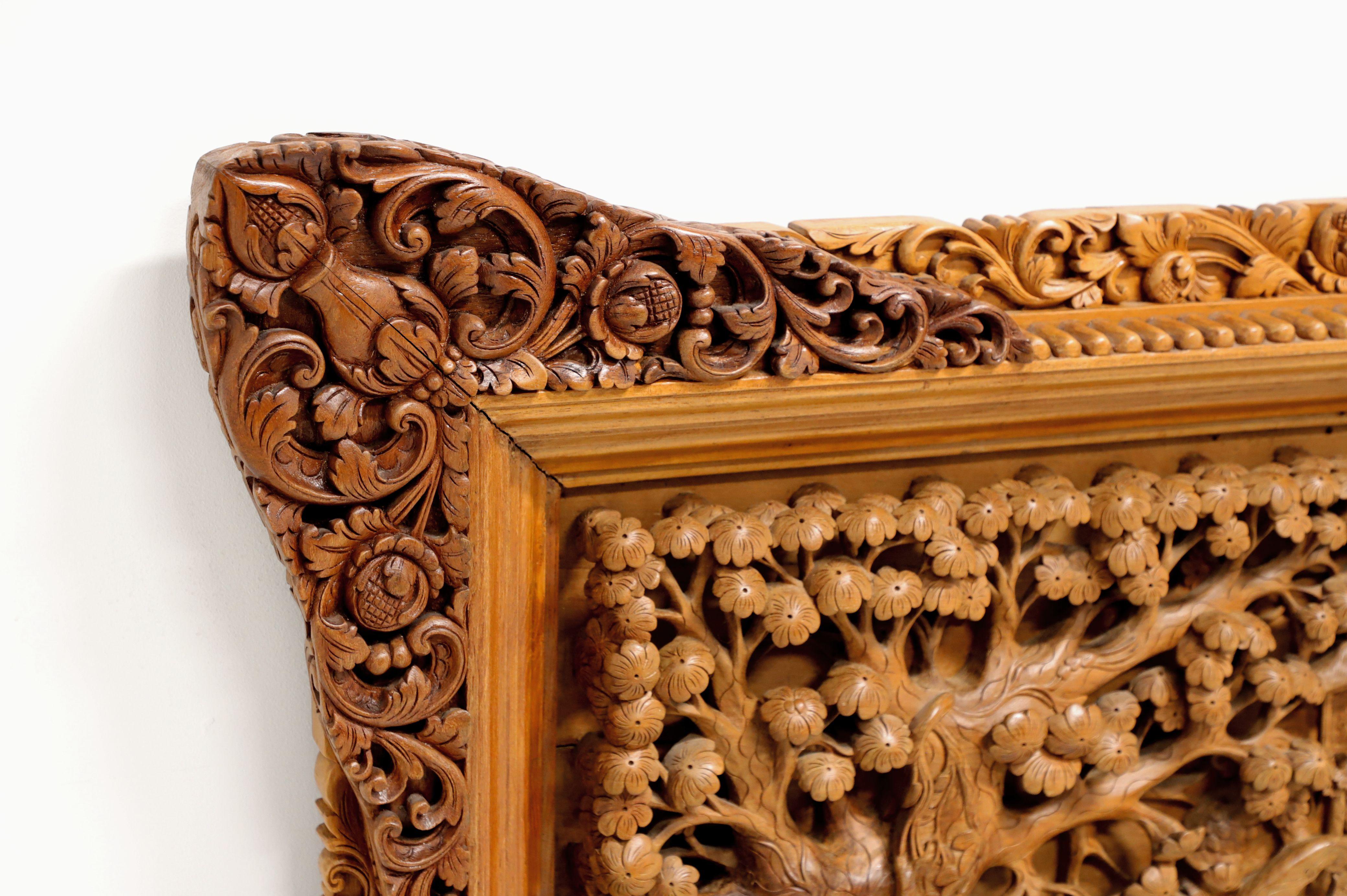 An original, massively scaled, hand carved teak art panel. Untitled, possibly depicting a Balinese royal procession. Intricate in detail and workmanship. Presented in an equally detailed carved teak frame that compliments the panel. A heavy-duty