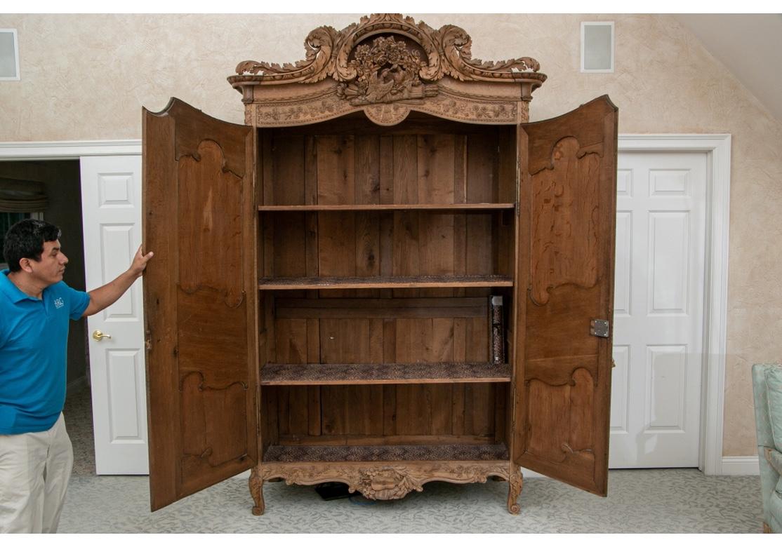 Massive and Elaborately Carved French Country Armoire In Distressed Condition In Bridgeport, CT