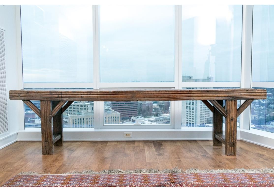 Originally purchased outside of Paris sixty years ago and believed to be from a Cathedral in France, possibly the region known as Brittany. The Table with great weight and solidity and having pegged construction, angled leg supports and simple
