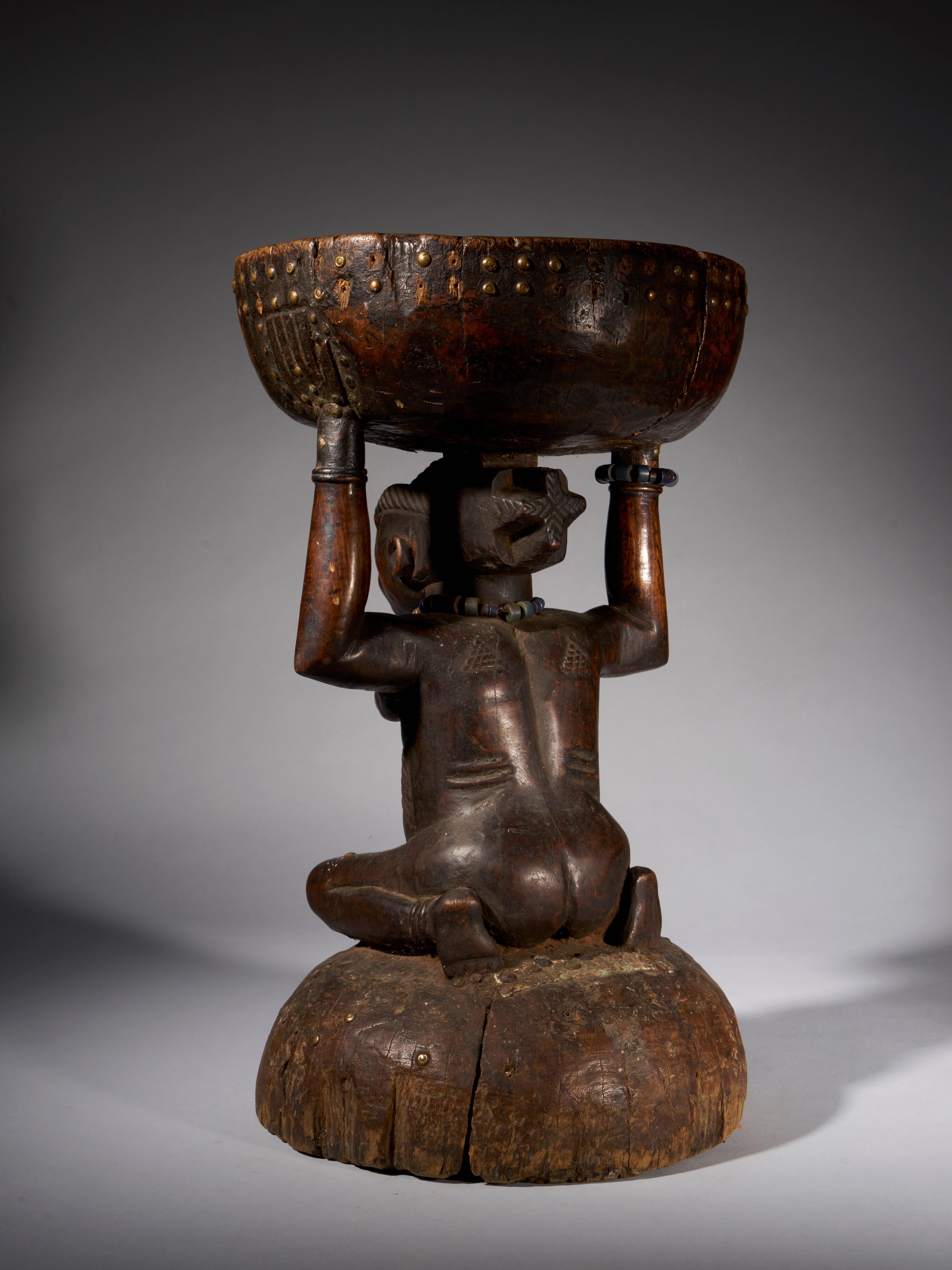 Congolese Massive and Robust Zela Caryatide Stool Held by a Female Sculpture