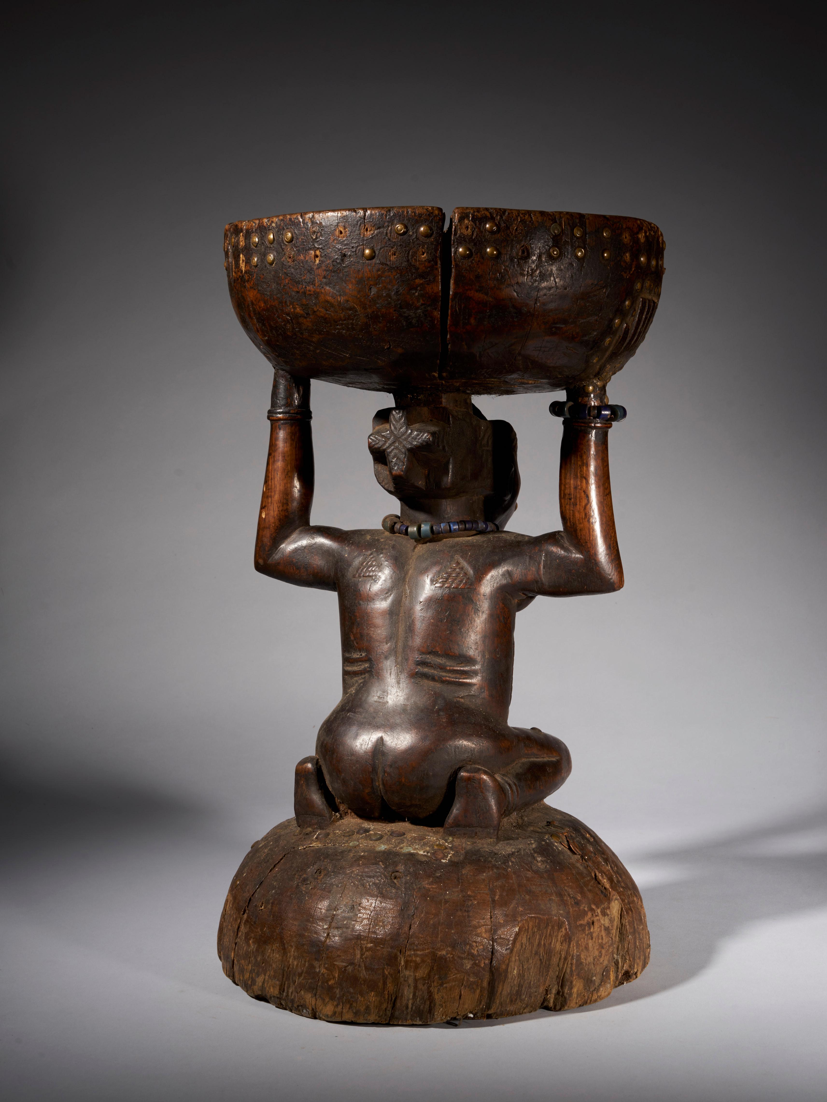 Hand-Carved Massive and Robust Zela Caryatide Stool Held by a Female Sculpture