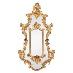 Massive miroir baroque ancien sculpté et doré