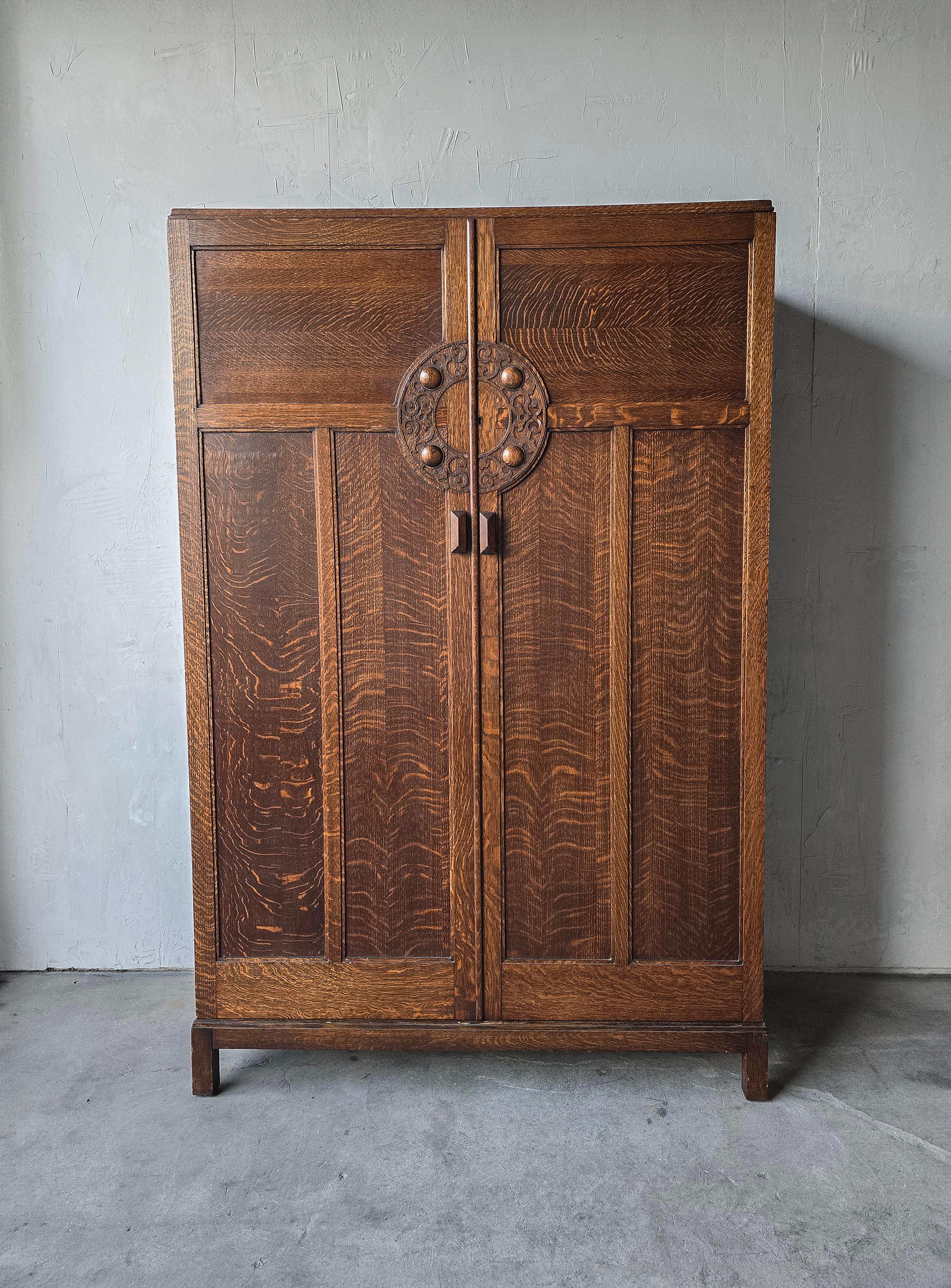 A beautiful example of an antique European armoire, unlike any that I have ever seen.  This piece is massive in size and character, carved wood handles and door details make it so beautiful.  Inside the double doors is a full length dressing mirror,