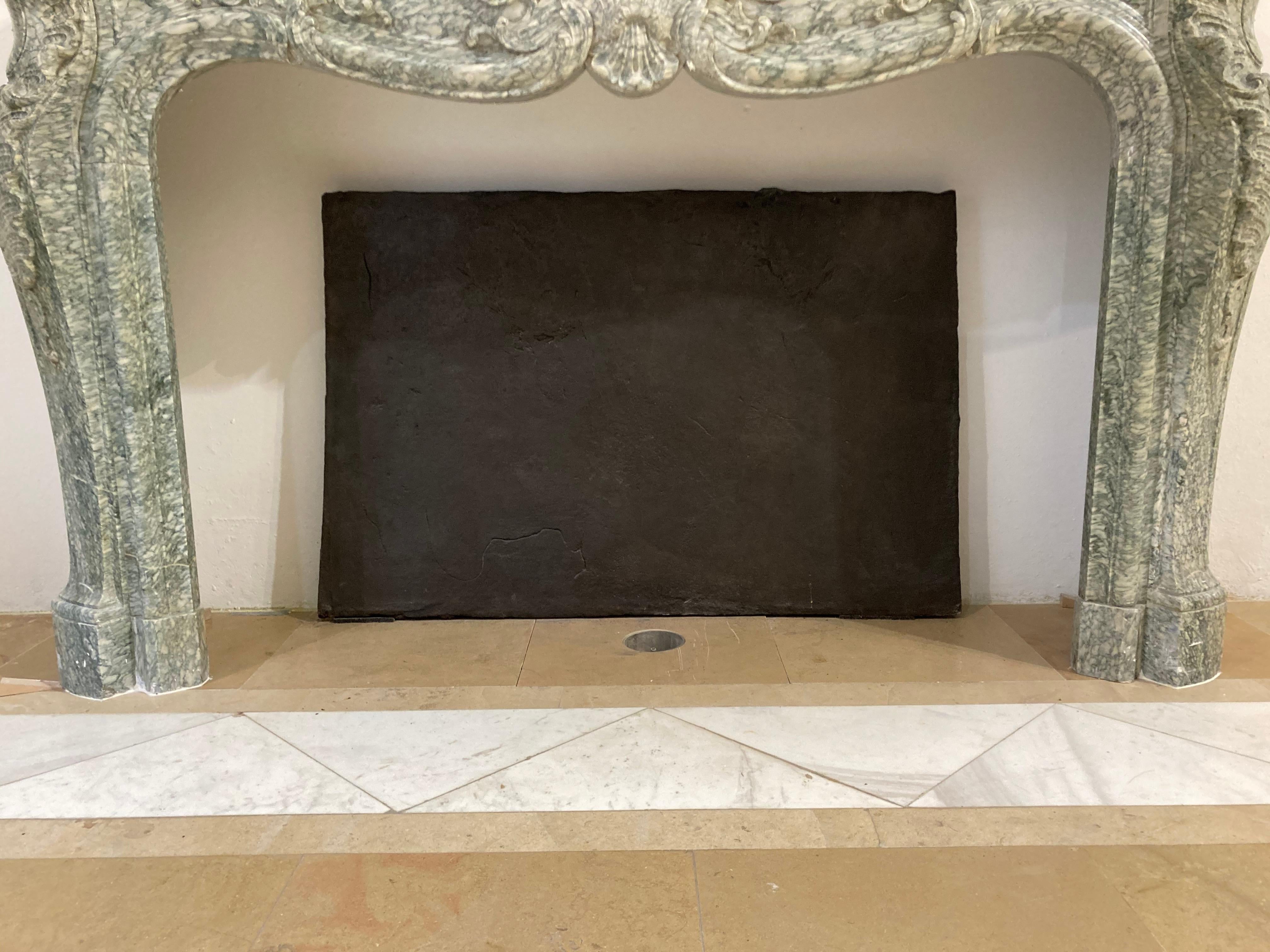Massive, solid antique cast-iron slab.
This gothic tapered beauty is almost 2 inches (5 cm) thick.
It probably was originally used as a hearth floor, because of its thickness the heat is stored and will radiate for hours after the fire is