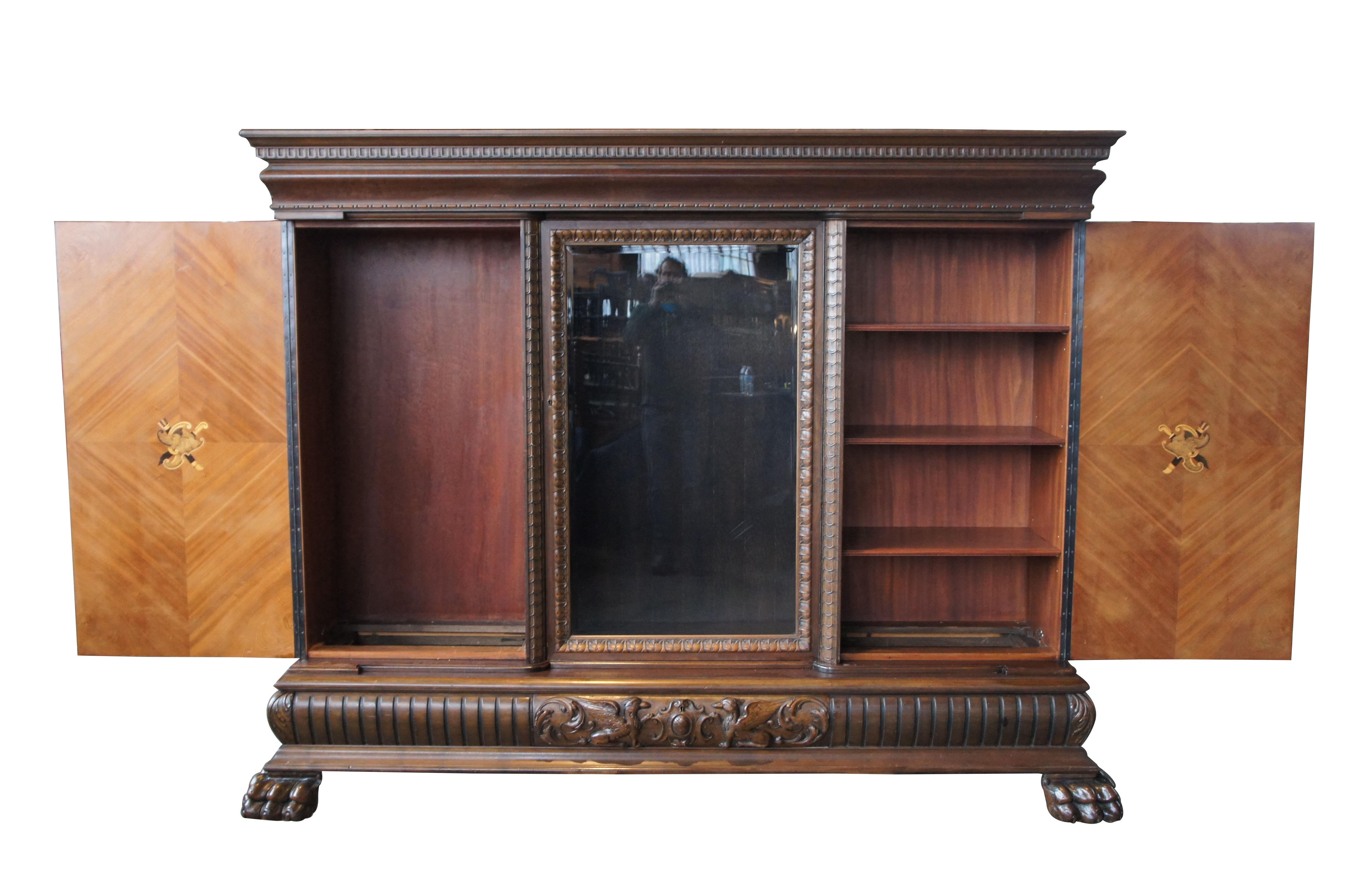 Massive antique Renaissance Revival walnut carved knockdown bookcase armoire

Made from walnut with extensive carvings and matchbook veneered outer panels. There are three-door compartments and one lower dovetailed drawer. All four areas are