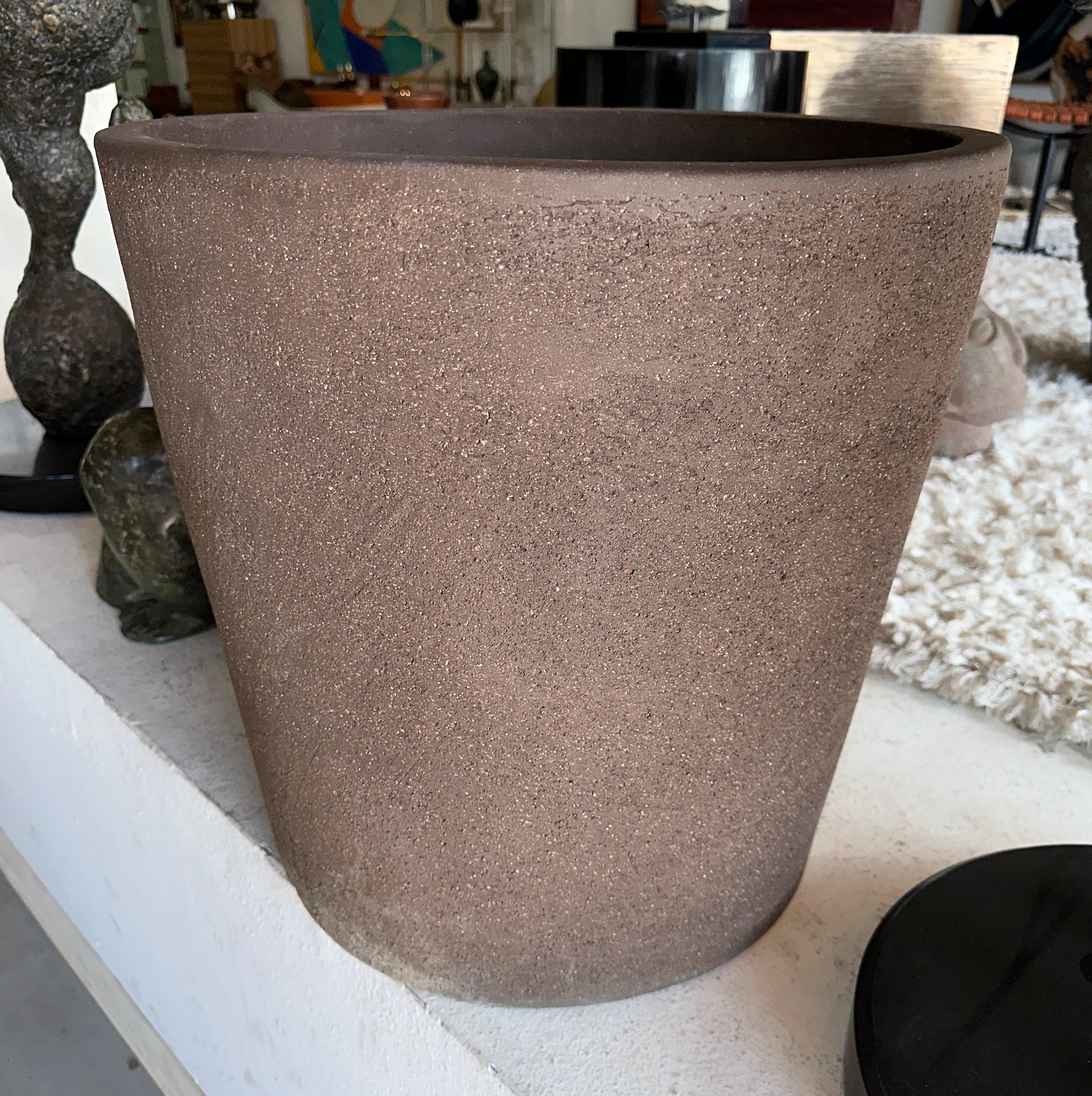 A massive architectural stoneware planter in the manner of David Cressey for Architectural Pottery or Stan Bitters. This piece of pottery was acquired from a wonderful Palm Springs estate that featured beautiful art and furnishings from major names