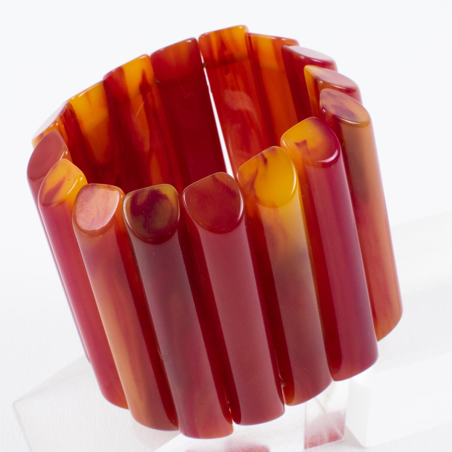 This is a superb Bakelite bracelet bangle that I think you'll love to wear or collect. The stretch design and oversized shape make it a rare find. The carved sticks add to their unique appeal with a gorgeous, intense hot pink fuchsia color with