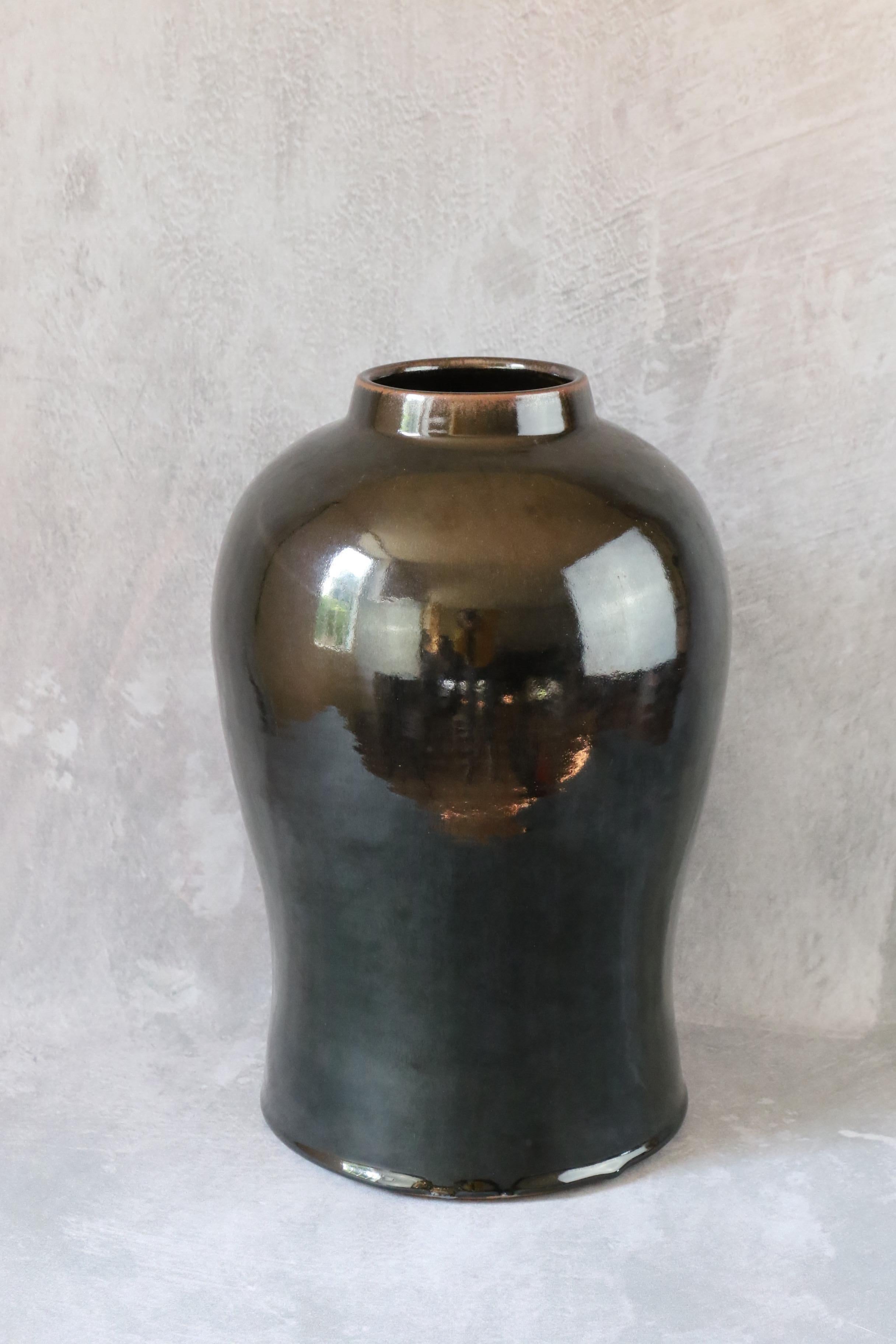 Massive black ceramic vase by the french ceramist Marc Uzan, Midcentury Modern

Stunning by is size, this is a beatiful and massive deep black vase.

Born in Sousse, Tunisia in 1955, Marc Uzan discovered modelling at the age of 18.
In the 1970s, he