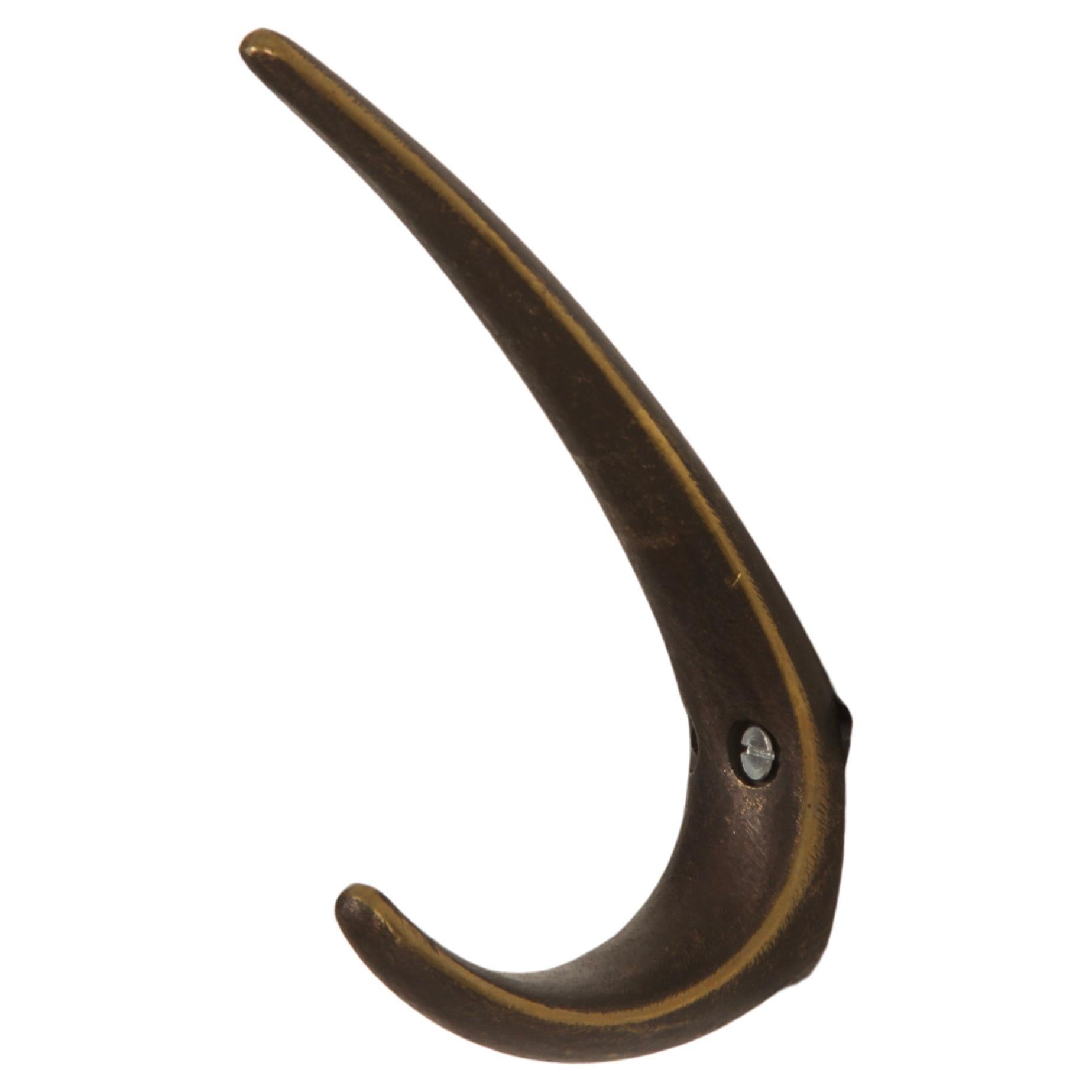 Brass hook manufactured in Austria in the 1950s