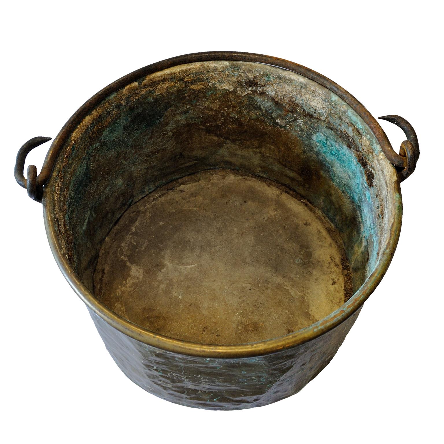 This is a massive early 18th century brass Louis XIV period Cauldron of great character from a large French chateau kitchen, circa 1720. 
A most interesting piece.