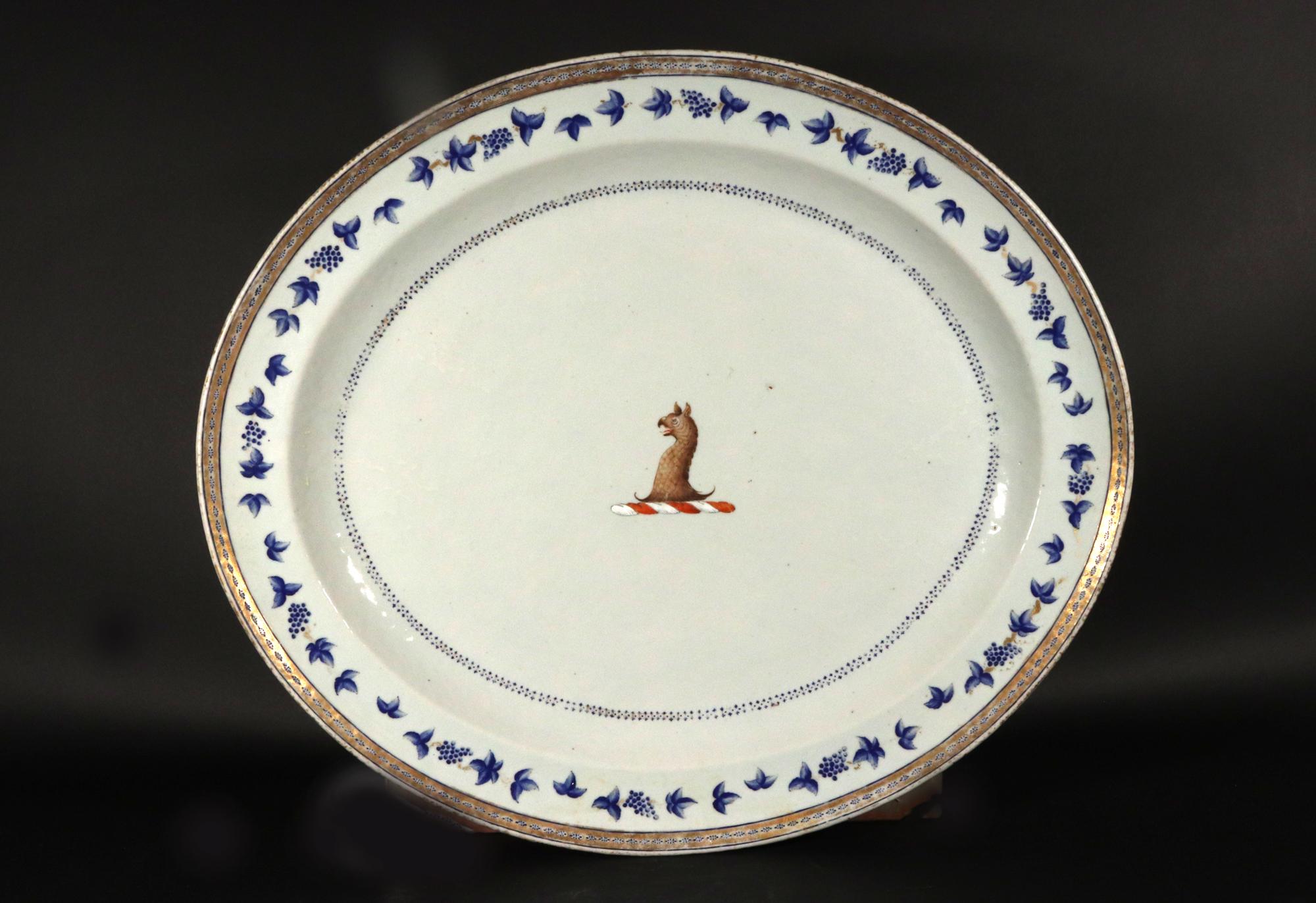 Chinese Export Porcelain Blue Enamel Border Armorial Crest Dish
Circa 1780

The Chinese Export porcelain armorial dish is of oval shape with a central large crest of an eagle's head with a triple dotted blue enamel border of stars at the edge of the
